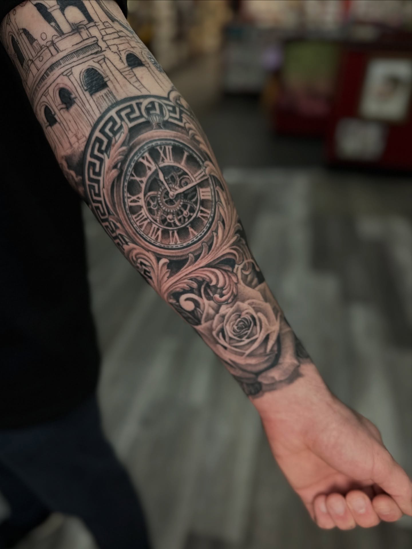 Clock and architecture realism tattoo on the forearm by Skoty Fox