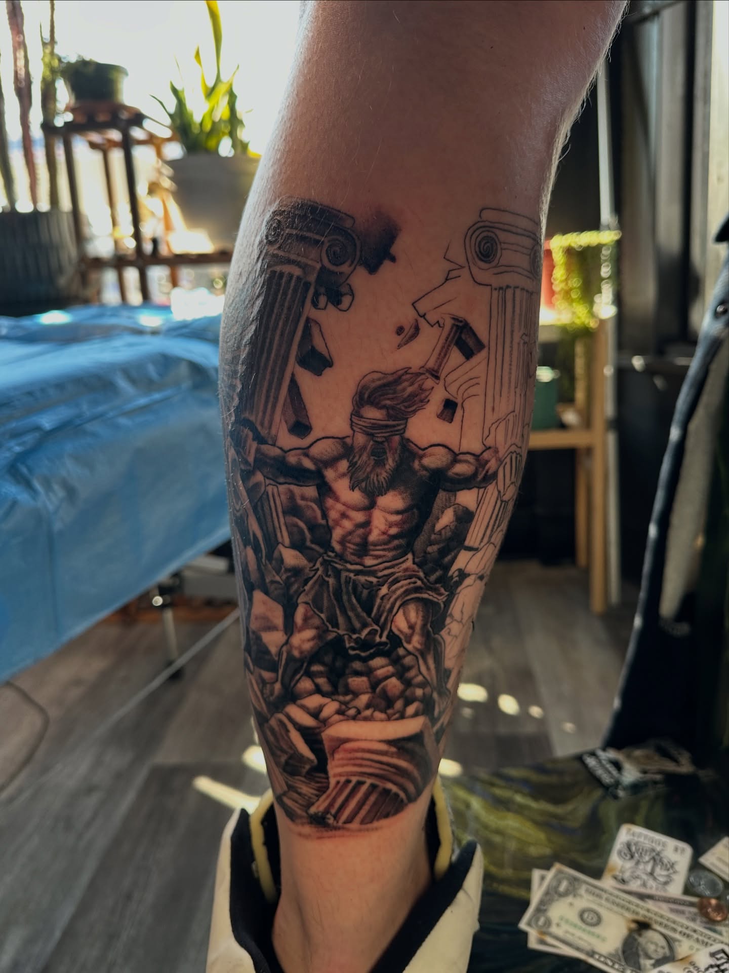 Muscular man with beard realism tattoo on the forearm by Skoty Fox