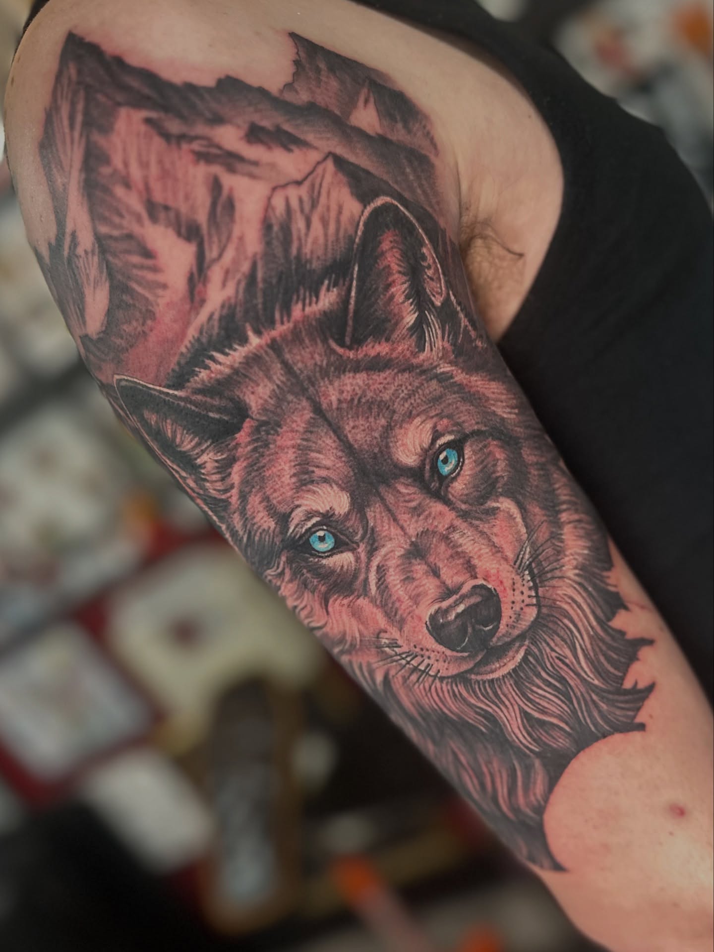Wolf realism tattoo on the forearm by Skoty Fox