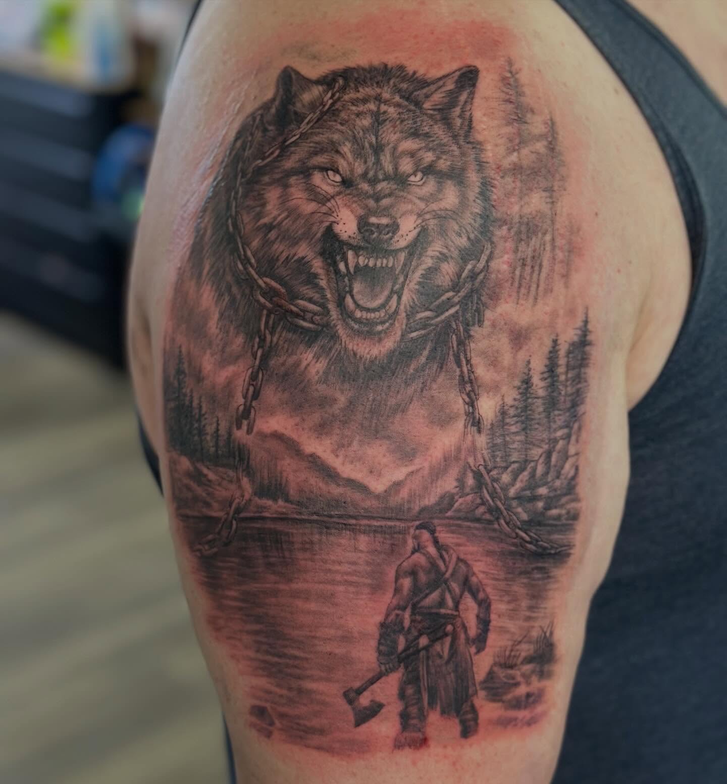 Wolf and warrior realism tattoo on the shoulder by Teddi Bird