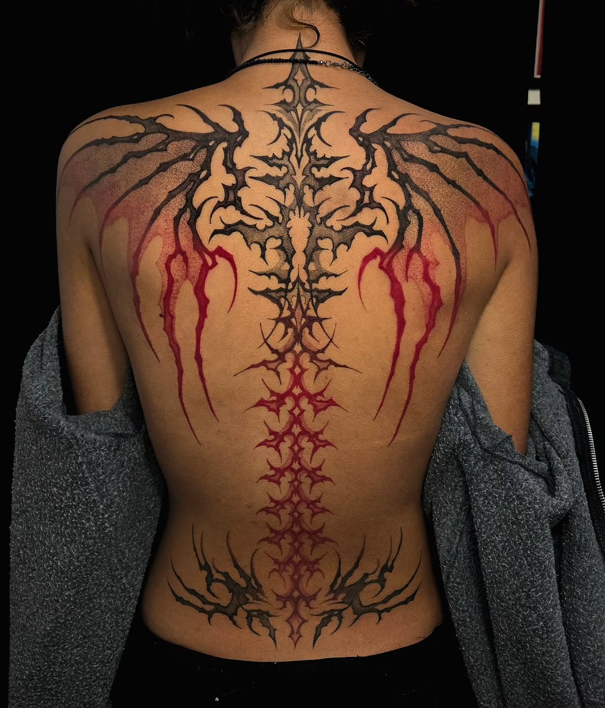 Spine tribal tattoo on the back by Jesseca Chinchilla