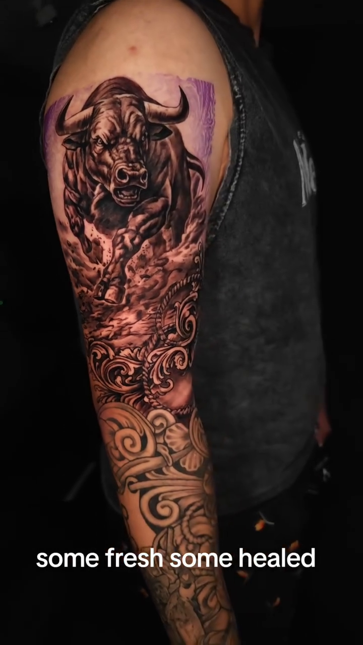 Bull and ornamental sleeve realism tattoo by Efren Del Rio