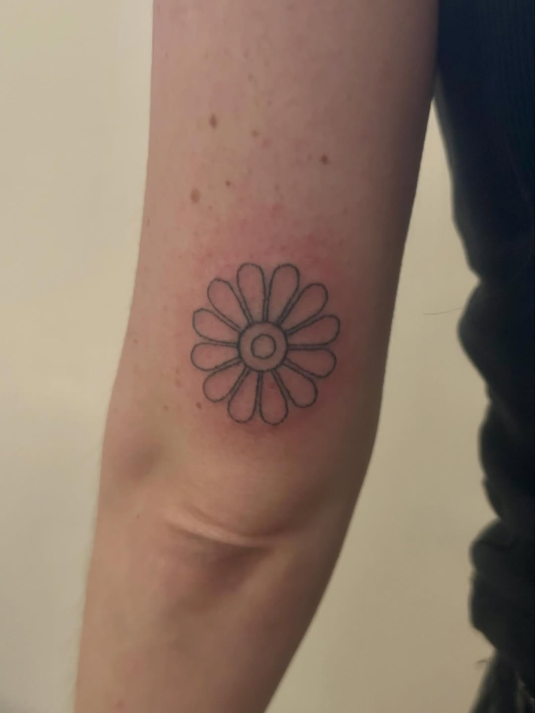 Flower ignorant tattoo on the forearm by Emma D
