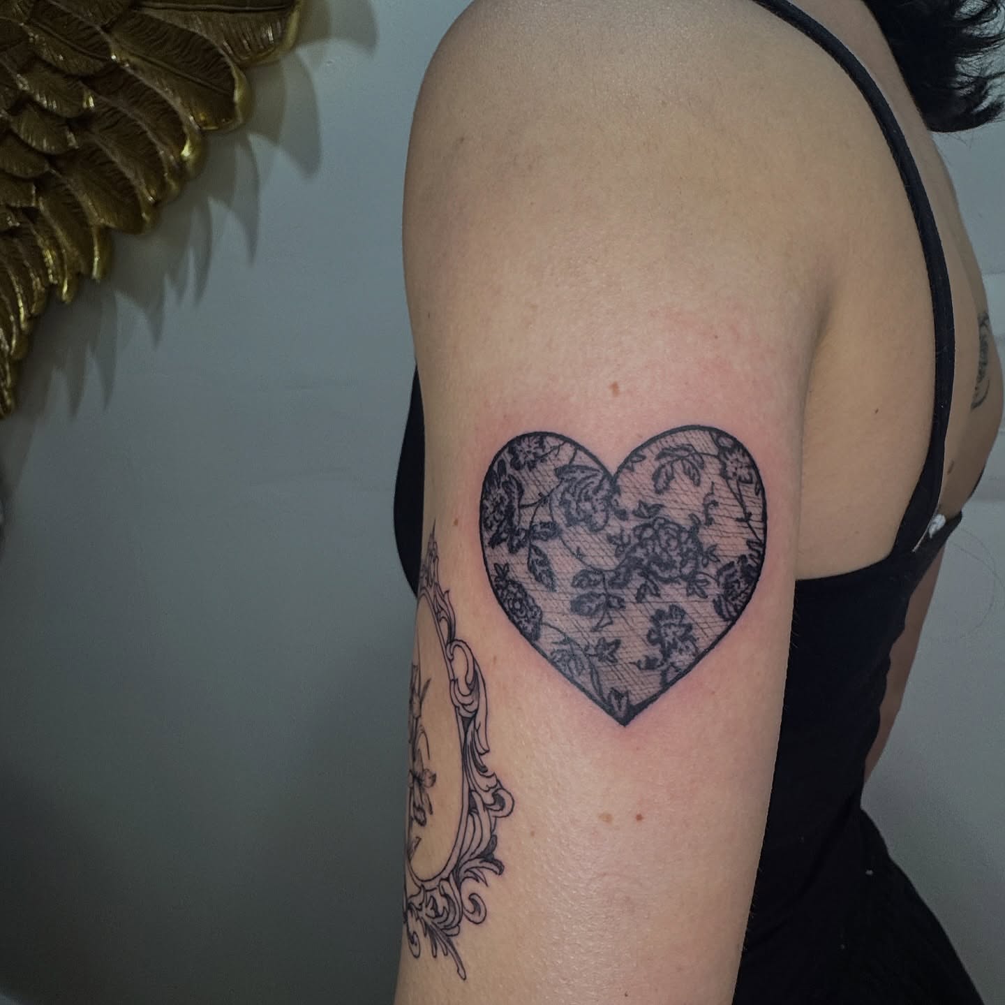 Heart black and grey tattoo on the shoulder by dev