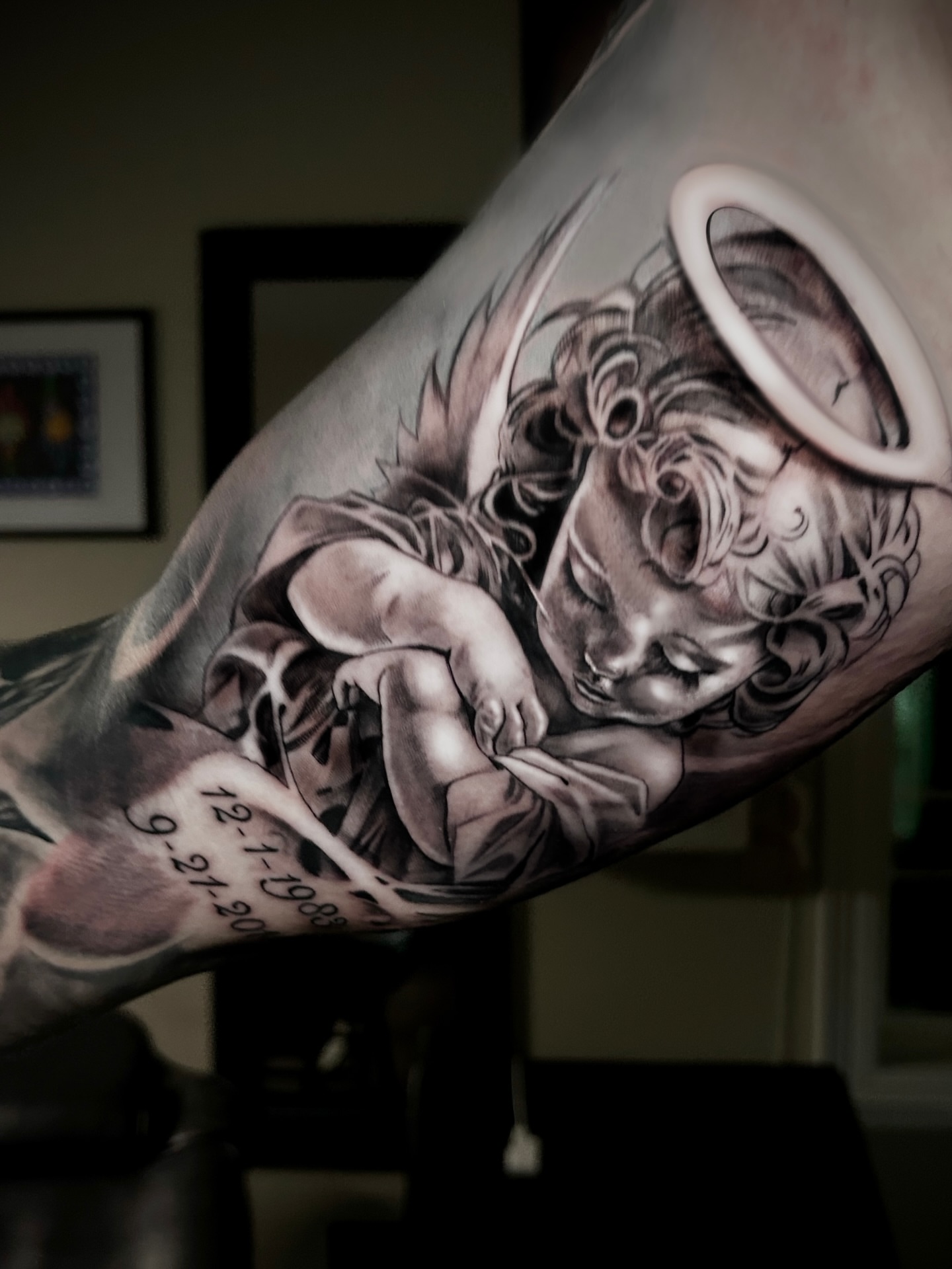 Cherub realism tattoo on the forearm by Alberto M
