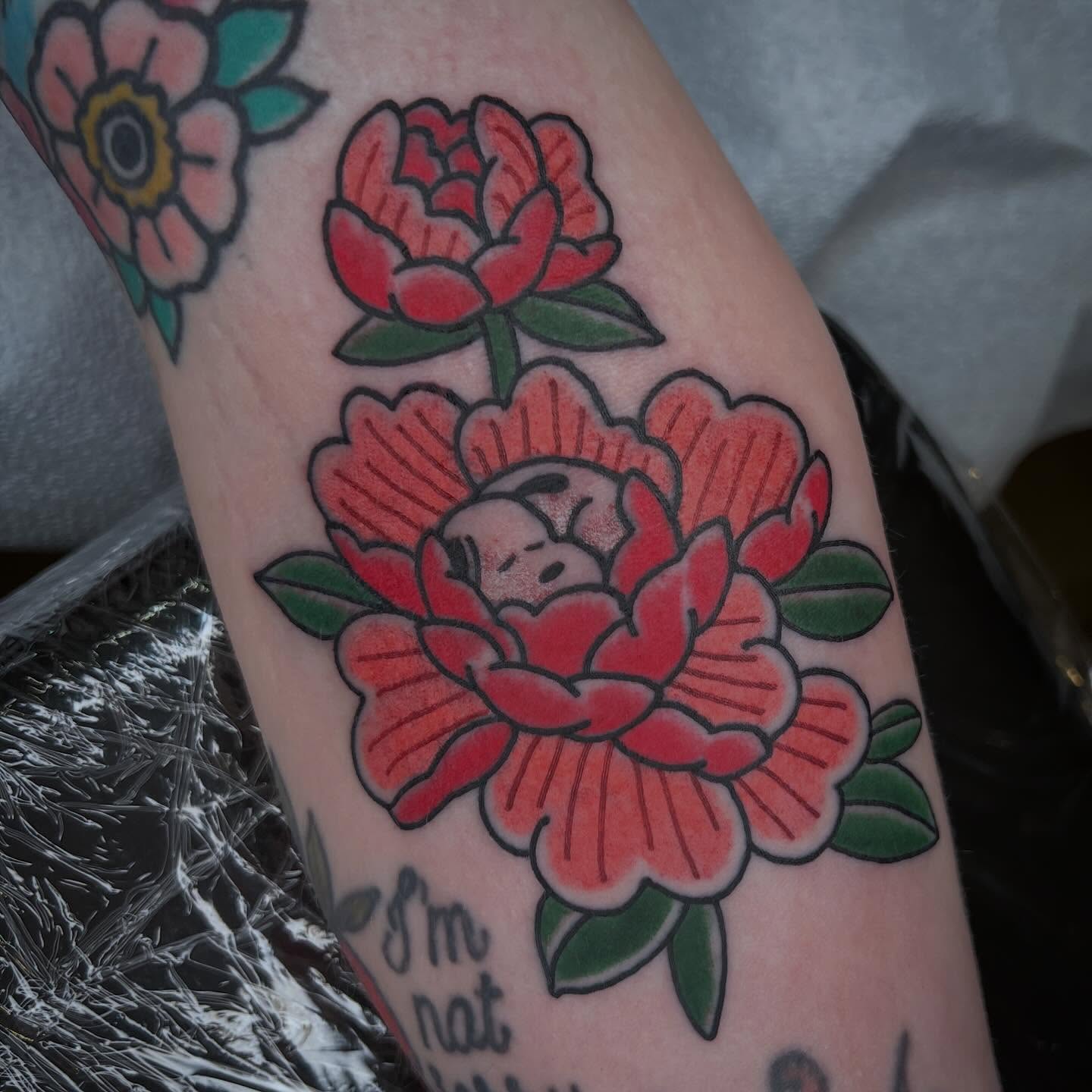 Flower with bear American traditional tattoo on the forearm by Troy David Souders