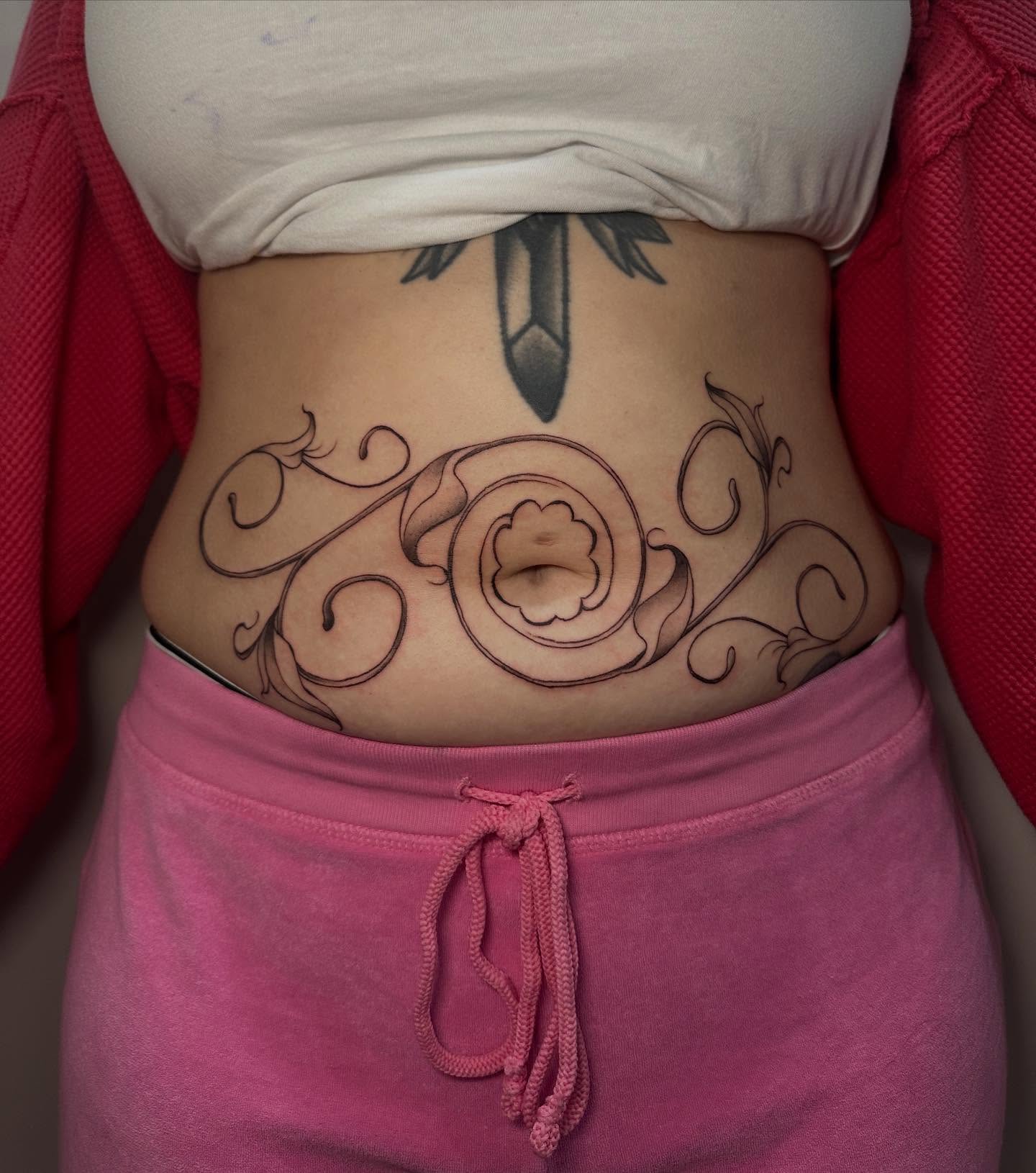Scrollwork ornamental tattoo on the torso by gabrielle rosemary ποΈ