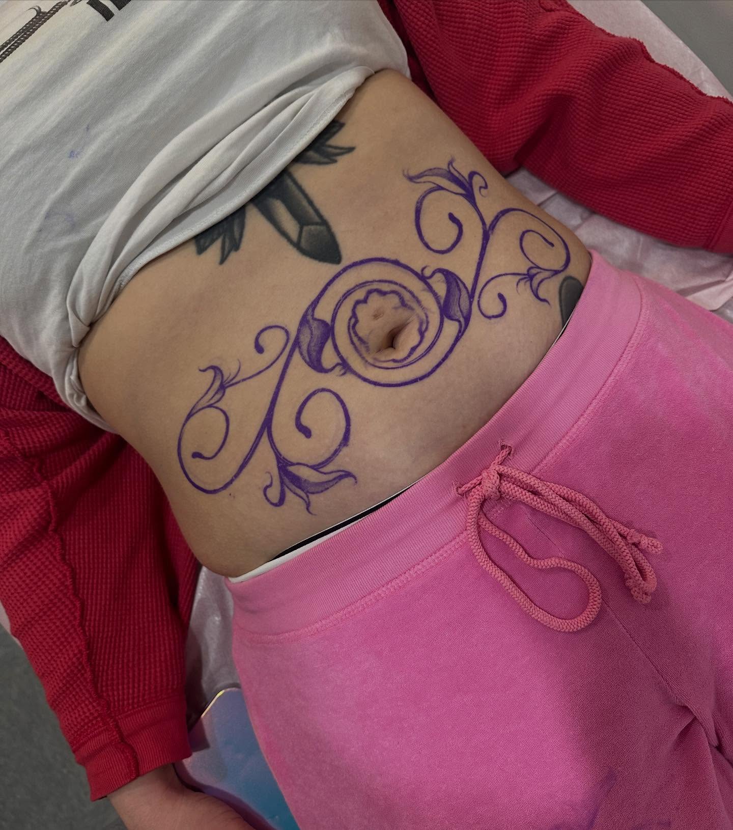 Scrollwork ornamental tattoo on the torso by gabrielle rosemary ποΈ