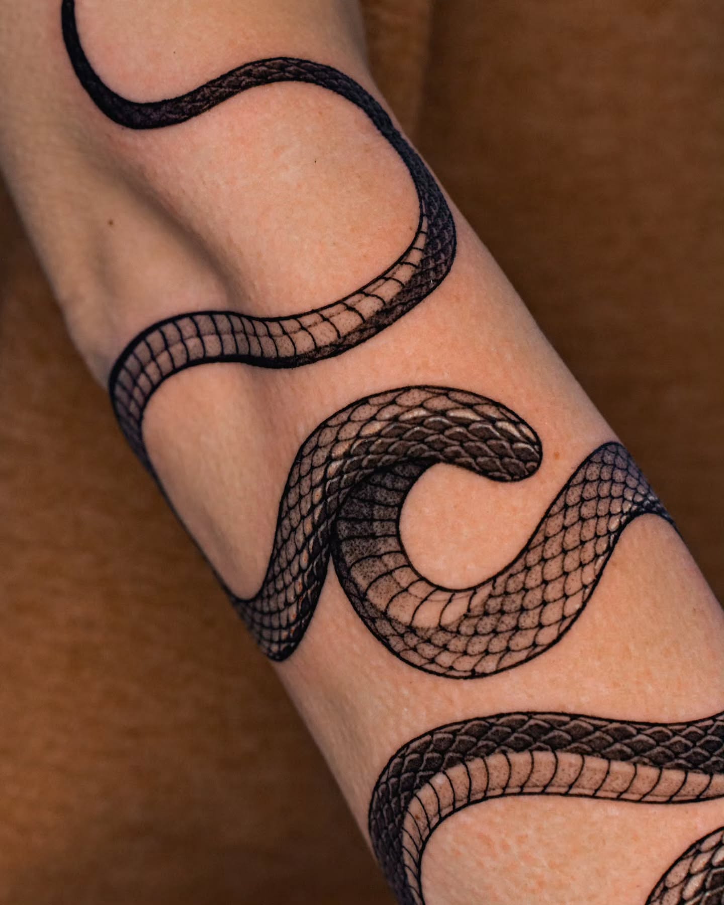 Snake black and grey tattoo on the forearm by 쿠노 Koono snaketattoo