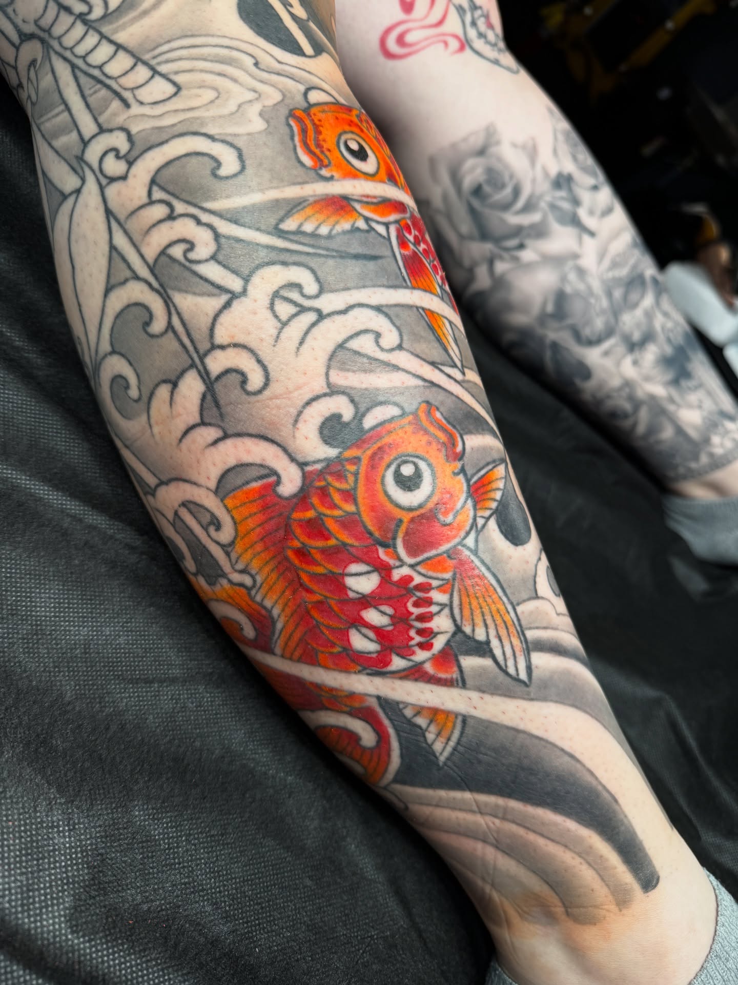 Koi fish American traditional tattoo on the forearm by Tattooer by Trade Wannabe Artist at Heart