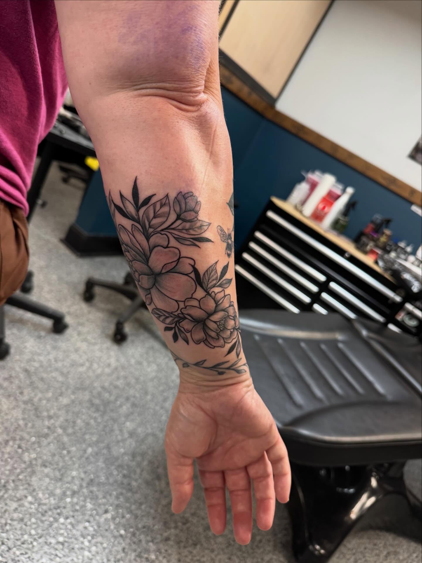 Floral bouquet black and grey tattoo on the forearm by “tatsbysabby”