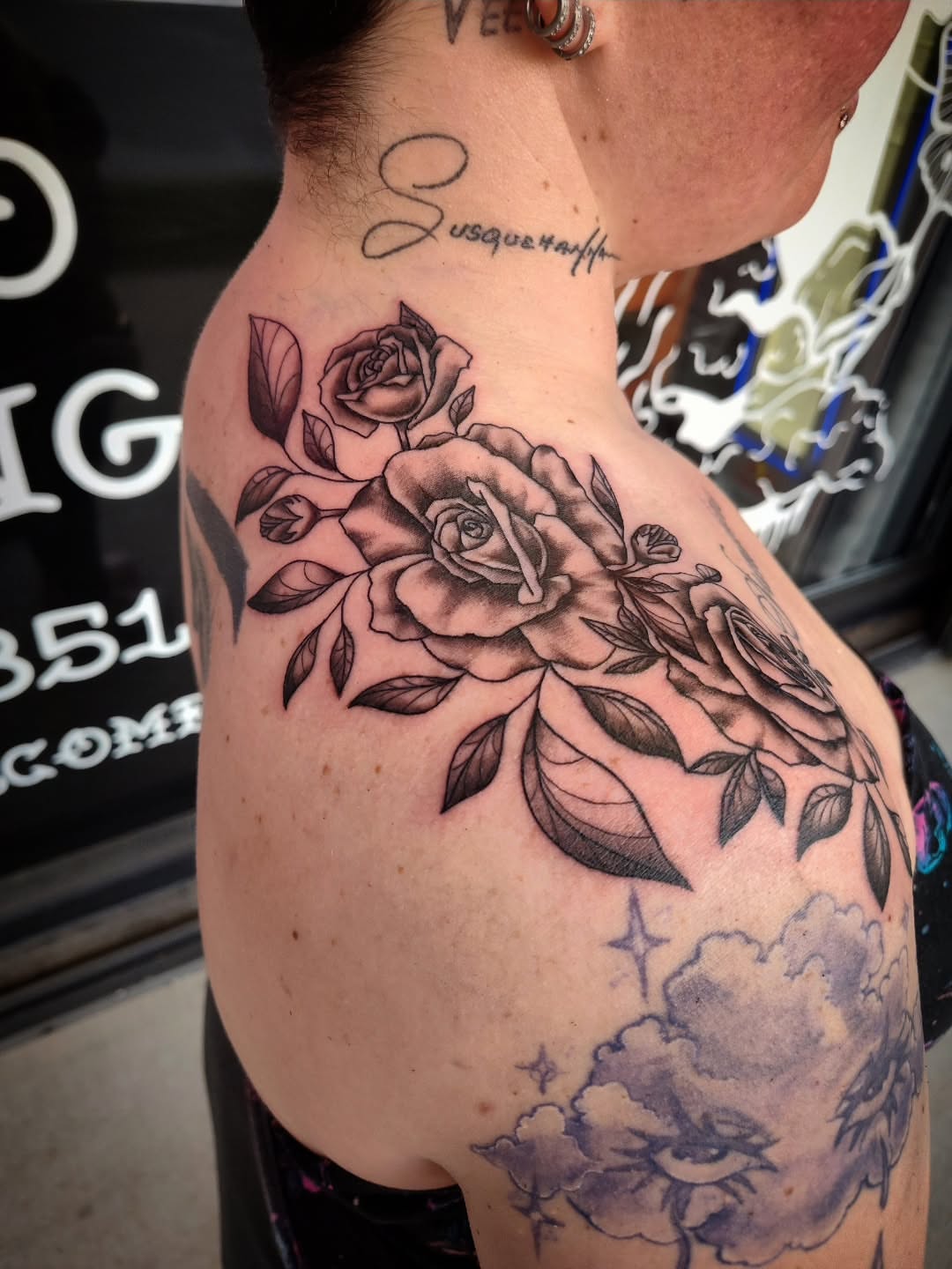 Roses black and grey tattoo on the shoulder by Julie MacDonald