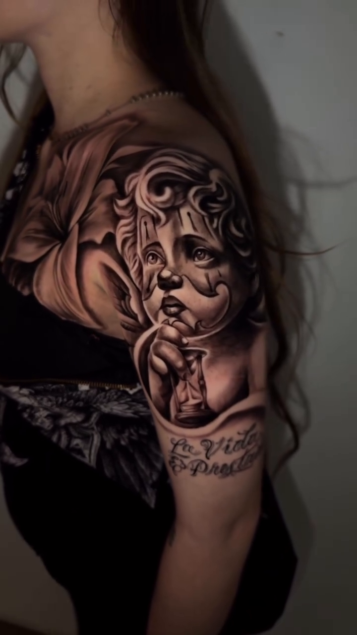 Woman with flowers realism tattoo by inkzombi