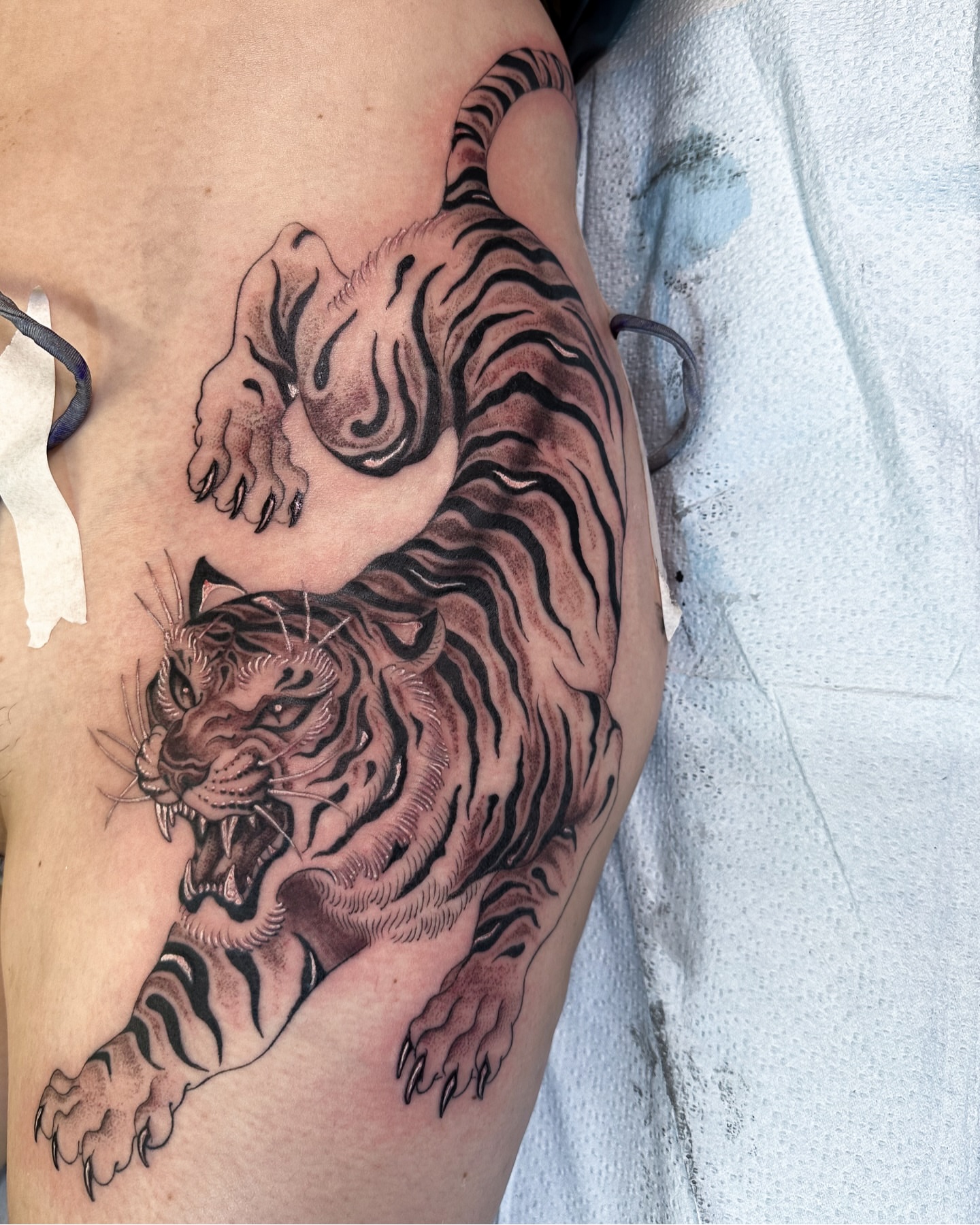 Tiger black and grey tattoo on the thigh by Colin Kenji Baker, San Jose, California