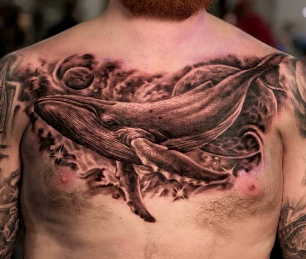Humpback whale in space fine line tattoo on the back by Comfy Chris Fettig