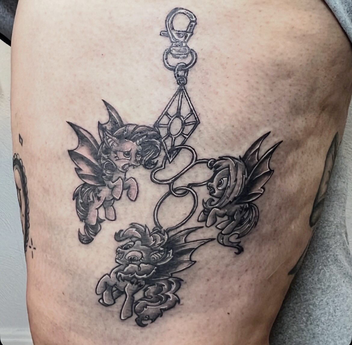 Mythical creatures black and grey tattoo on the thigh by Amber Rose