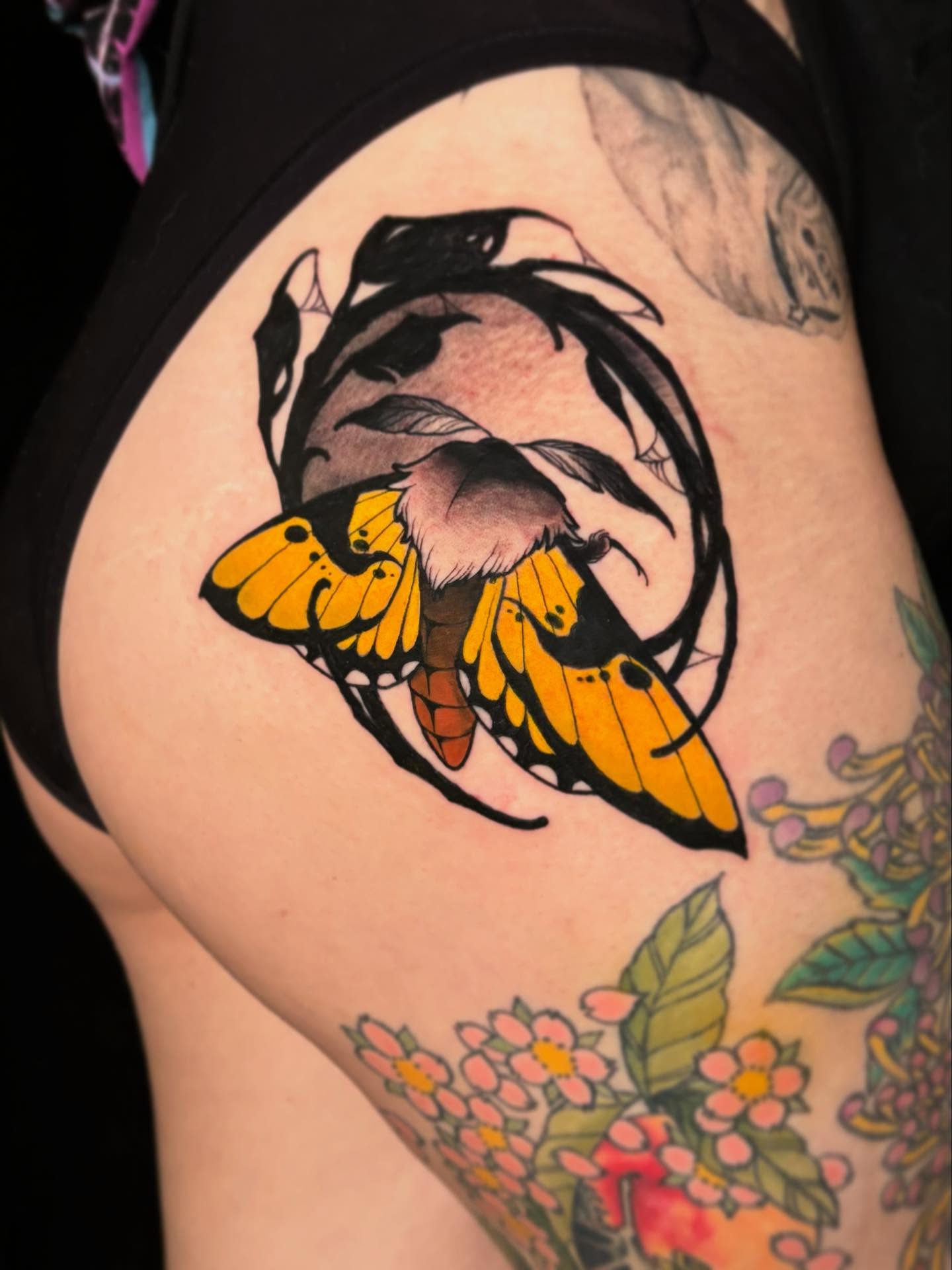 Butterfly American traditional tattoo on the thigh by Riley Borne
