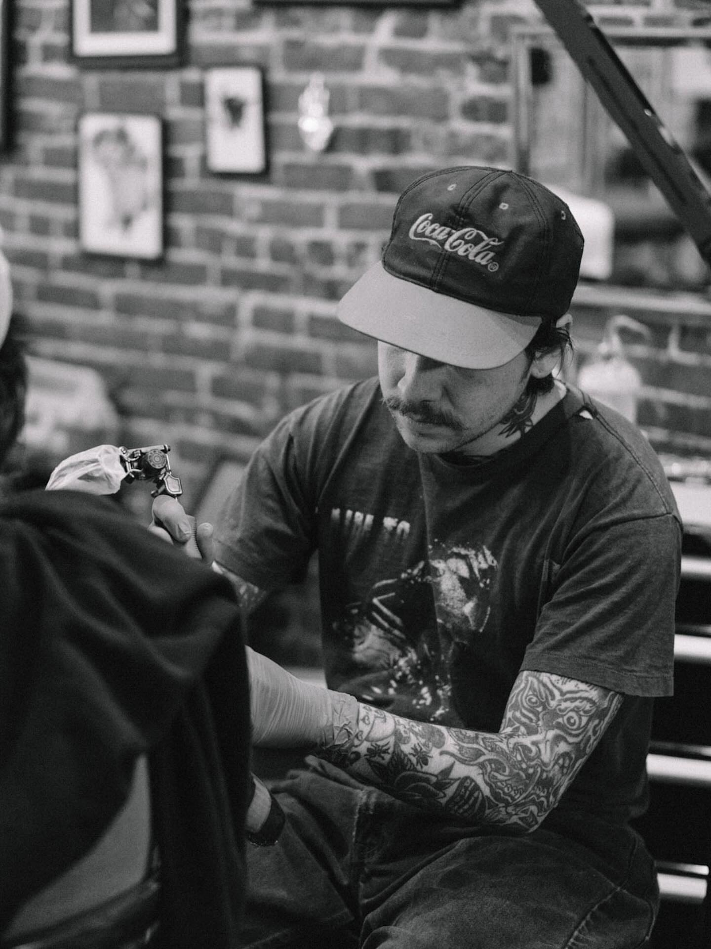 Tattoo artist black and grey tattoo on the upper arm by Bryce Shearer