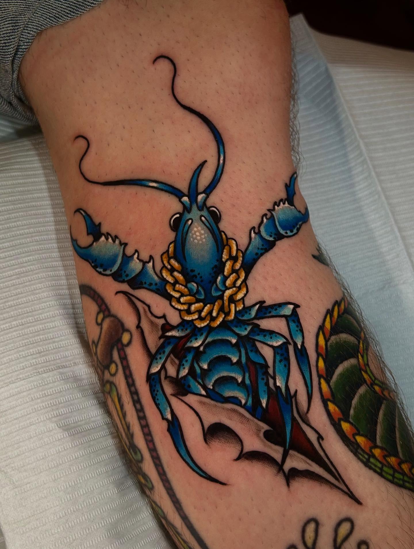 Lobster American traditional tattoo on the forearm by Lexi Kniskern