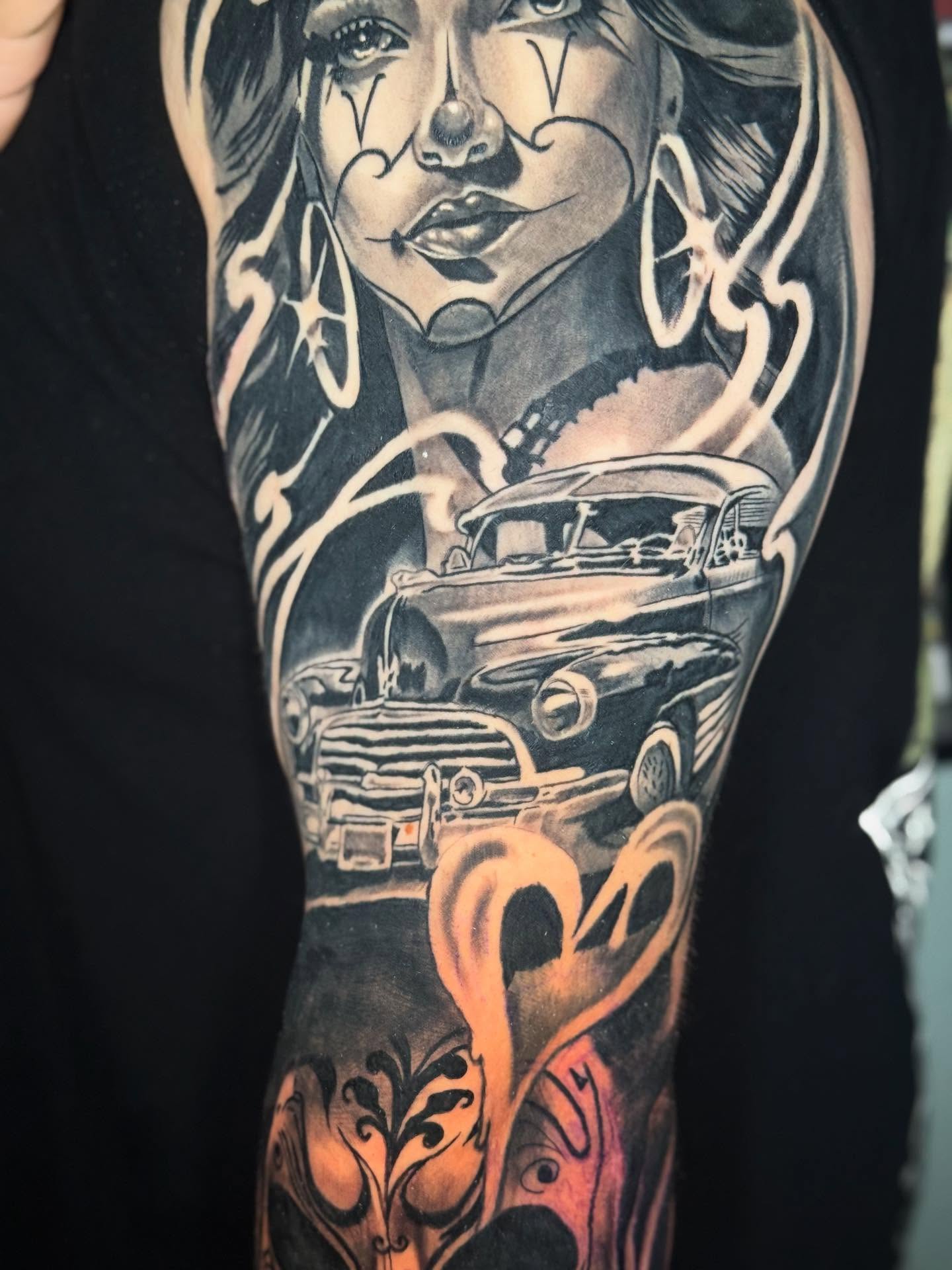 Woman with car realism tattoo on the forearm by Joseph Pacheco