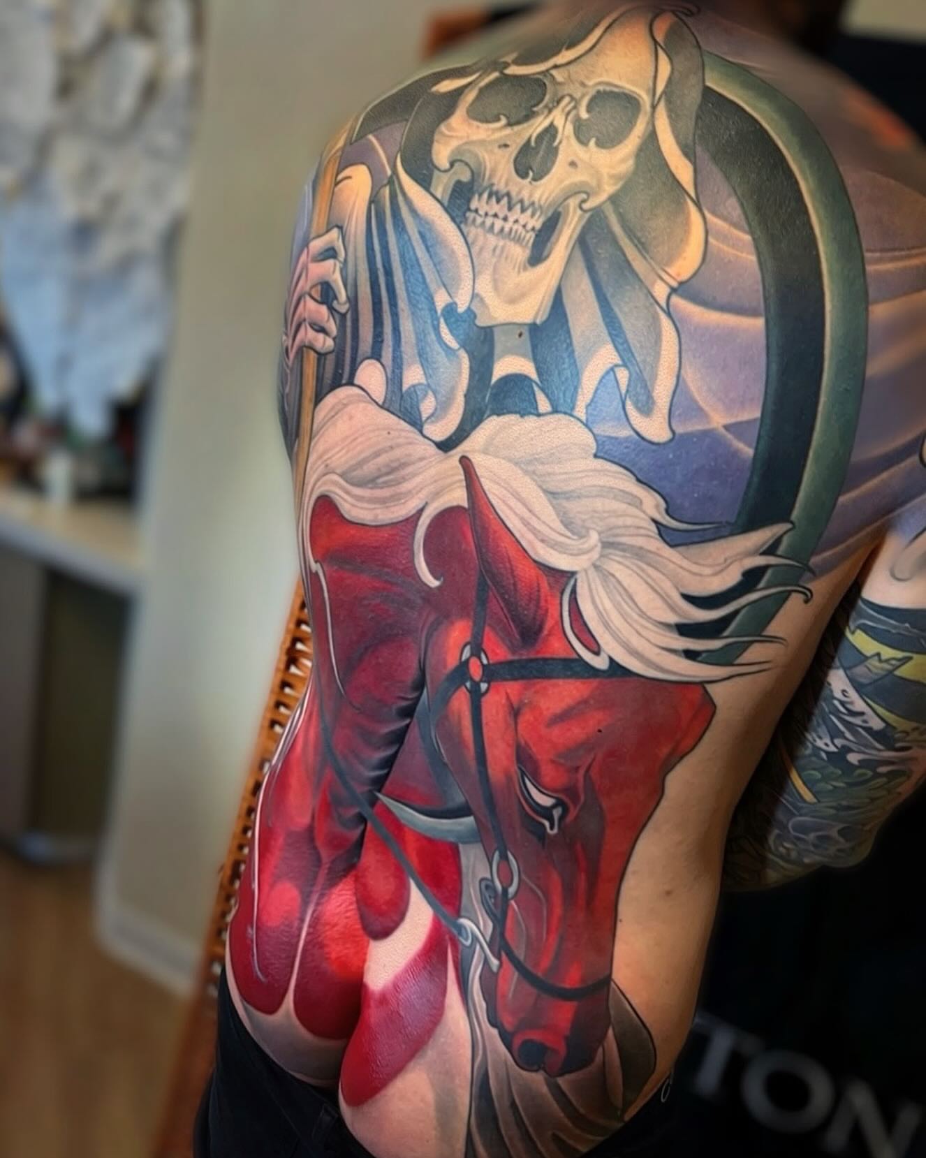 Reaper and horse realism tattoo on the shoulder by Jeff Norton, Atascadero, California