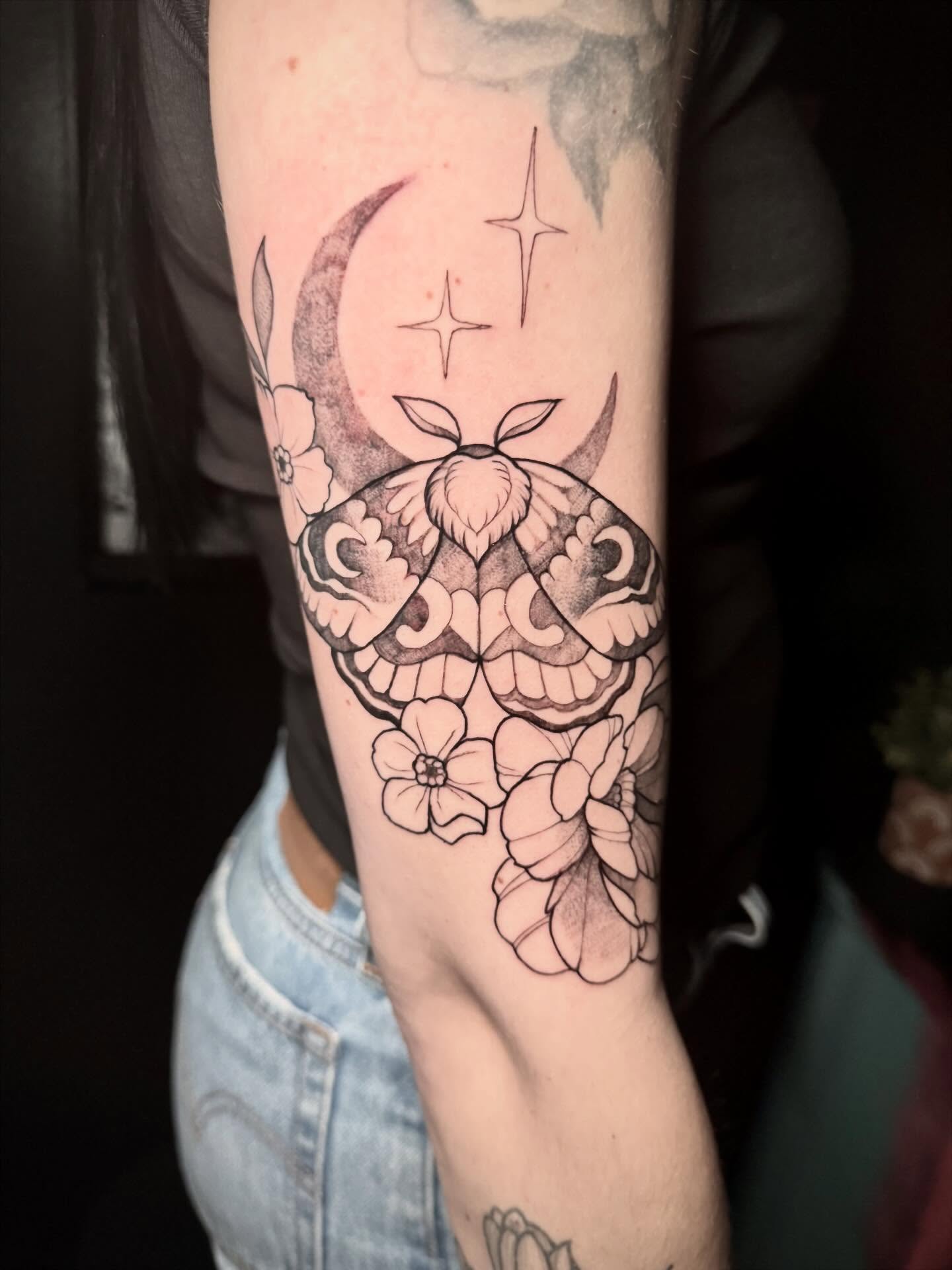 Moth and flowers ornamental tattoo on the forearm by Kayla Rosencrans