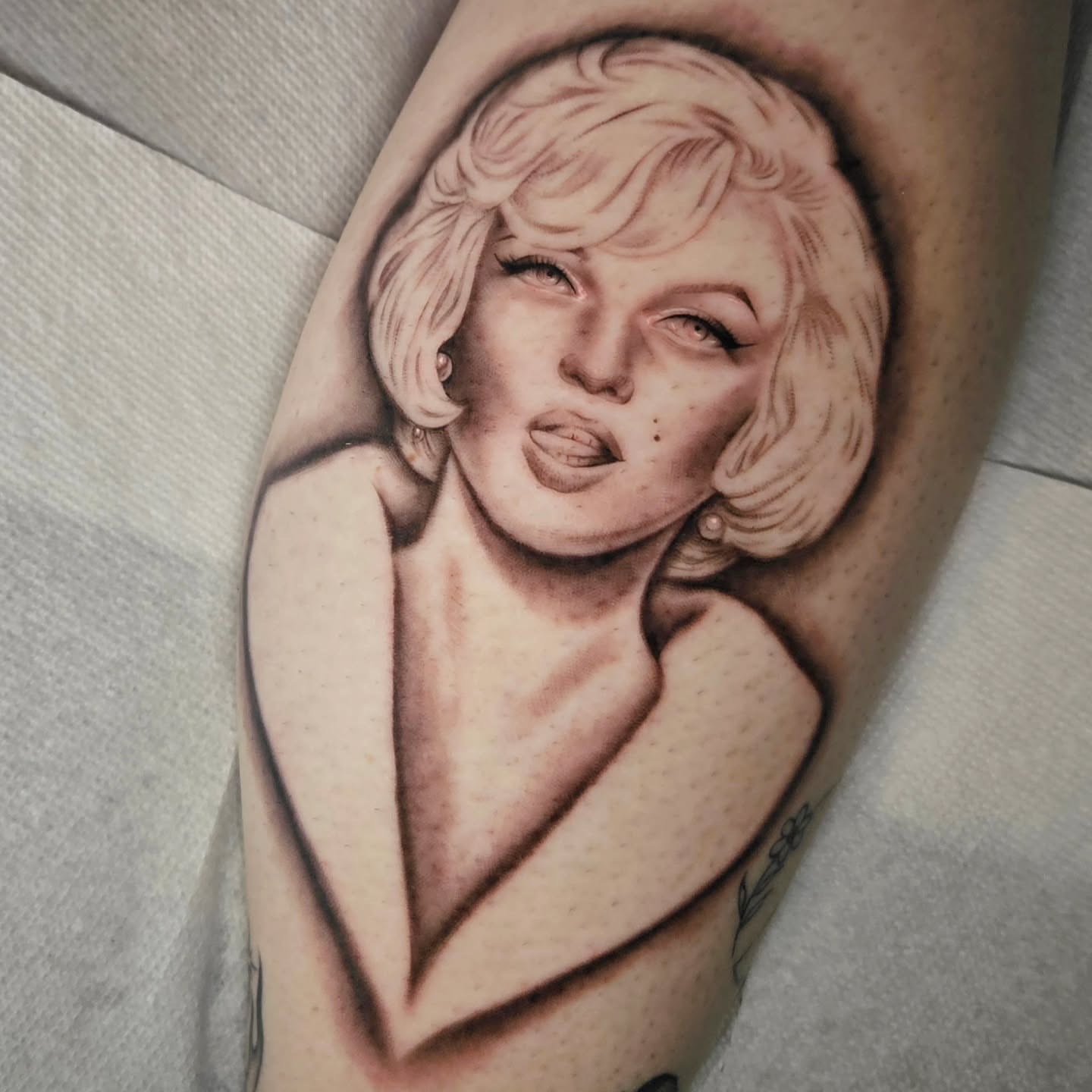 Marilyn monroe realism tattoo on the forearm by Courtlyn Bliss
