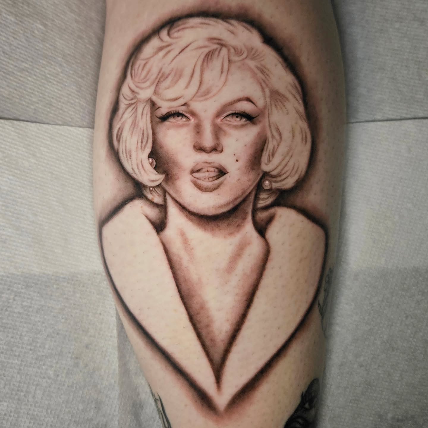 Blonde woman realism tattoo on the forearm by Courtlyn Bliss