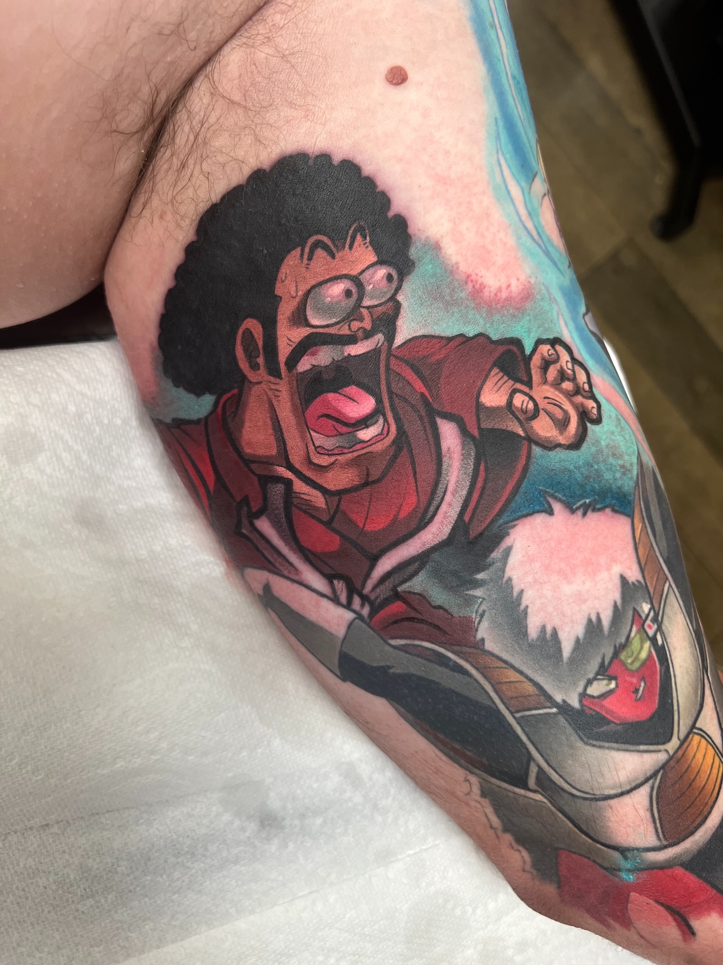 Cartoon character anime tattoo on the forearm by Jake lyon