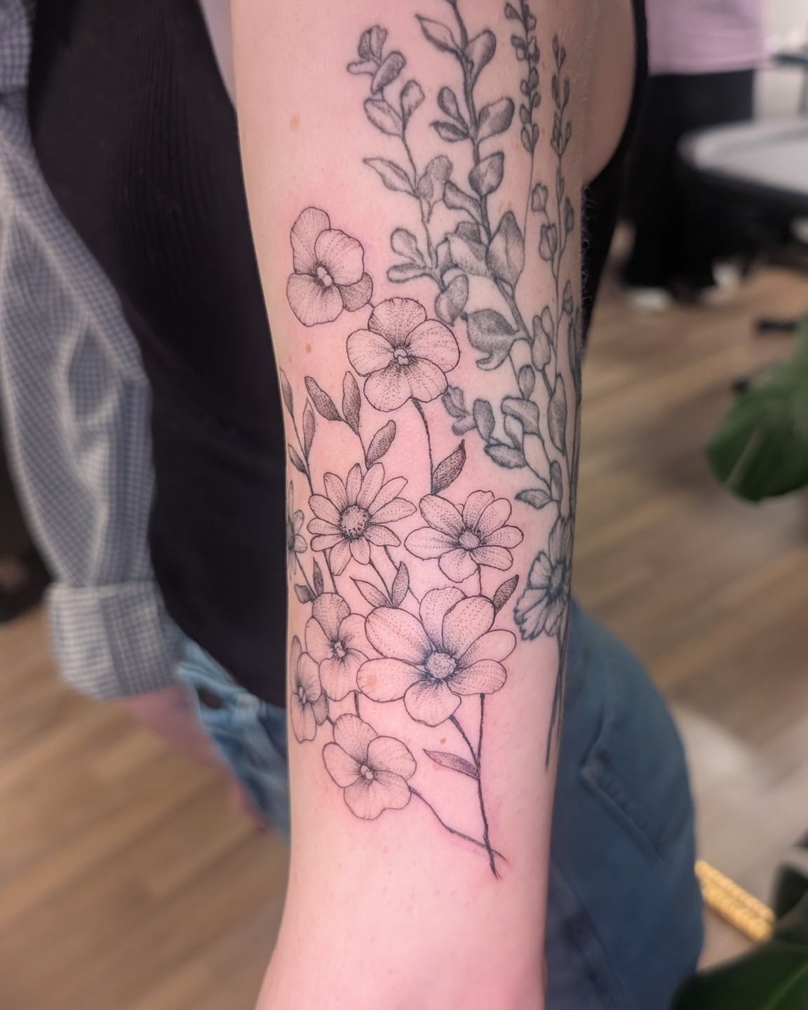 Floral arrangement dotwork tattoo on the forearm by Arminda Walborn