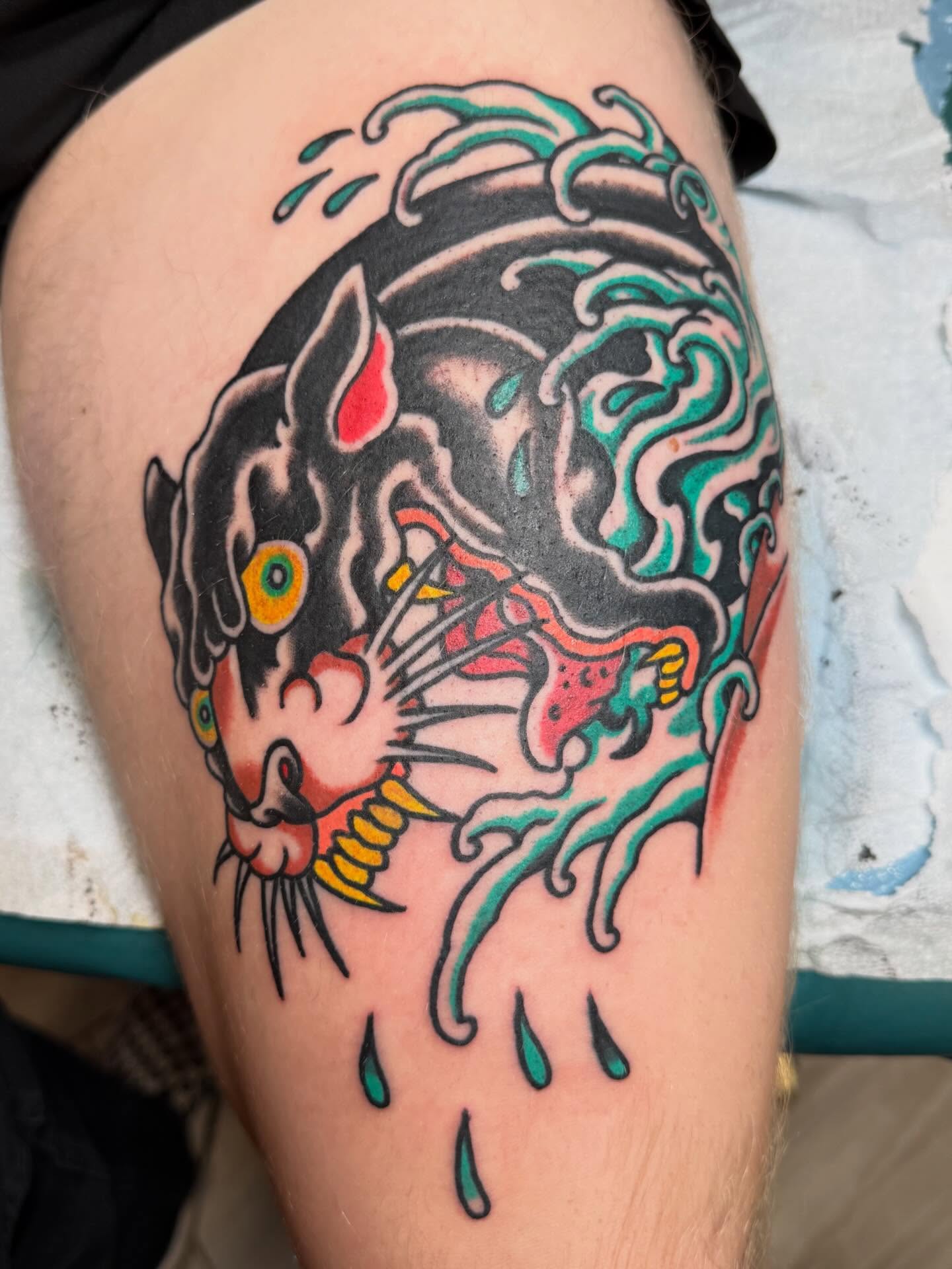 Cat American traditional tattoo on the thigh by Bill Crawford, Plymouth, Michigan