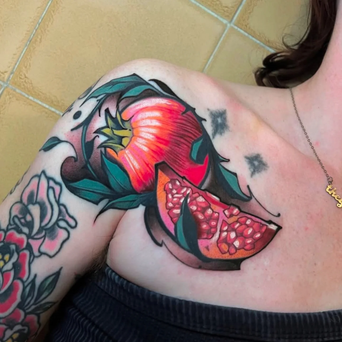 Pomegranate American traditional tattoo on the shoulder by ᴍɪʟᴀ ꜱᴀꜱɪᴇᴛᴀ