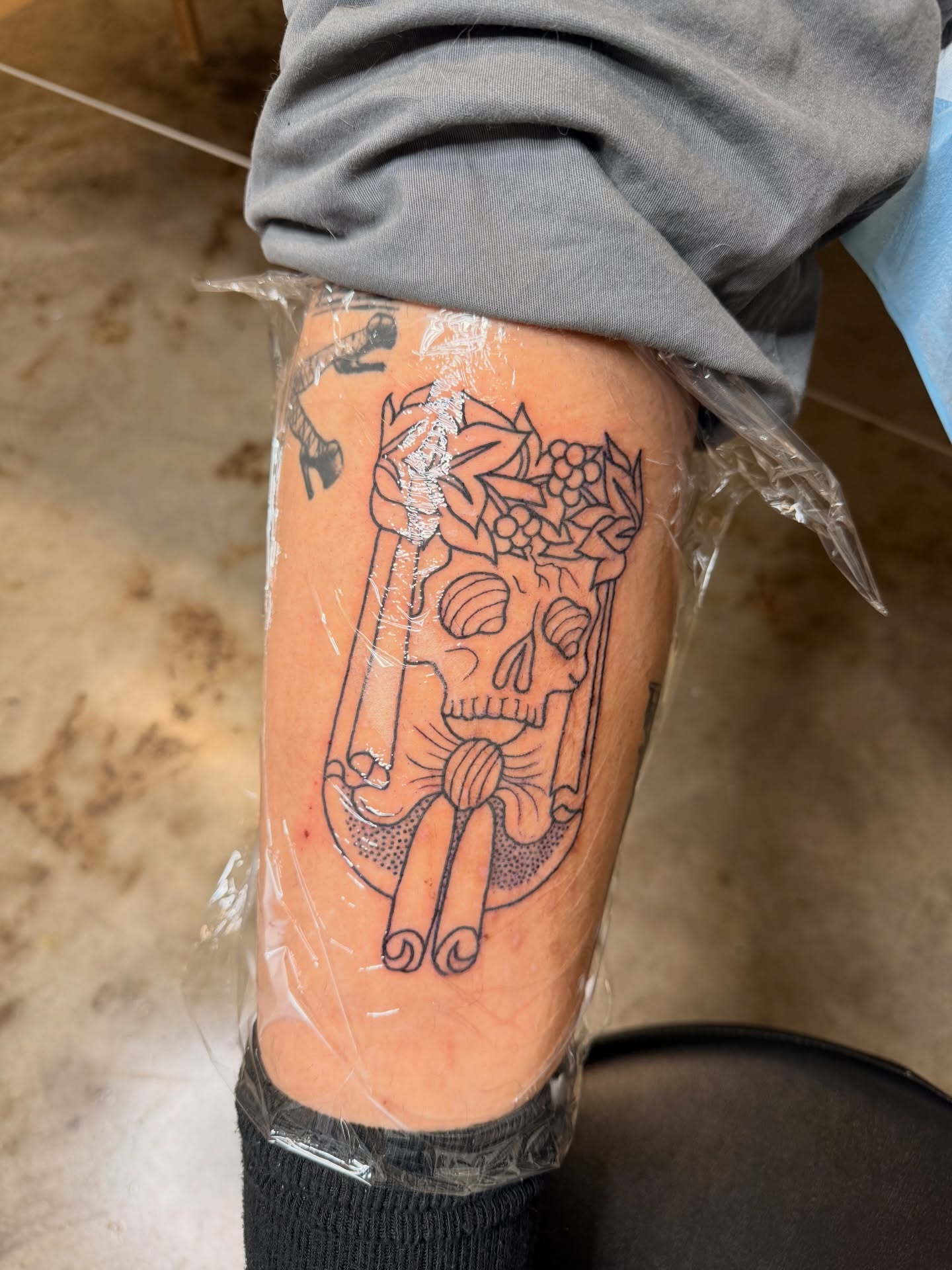 Sugar skull black and grey tattoo on the forearm by Kate Ortiz