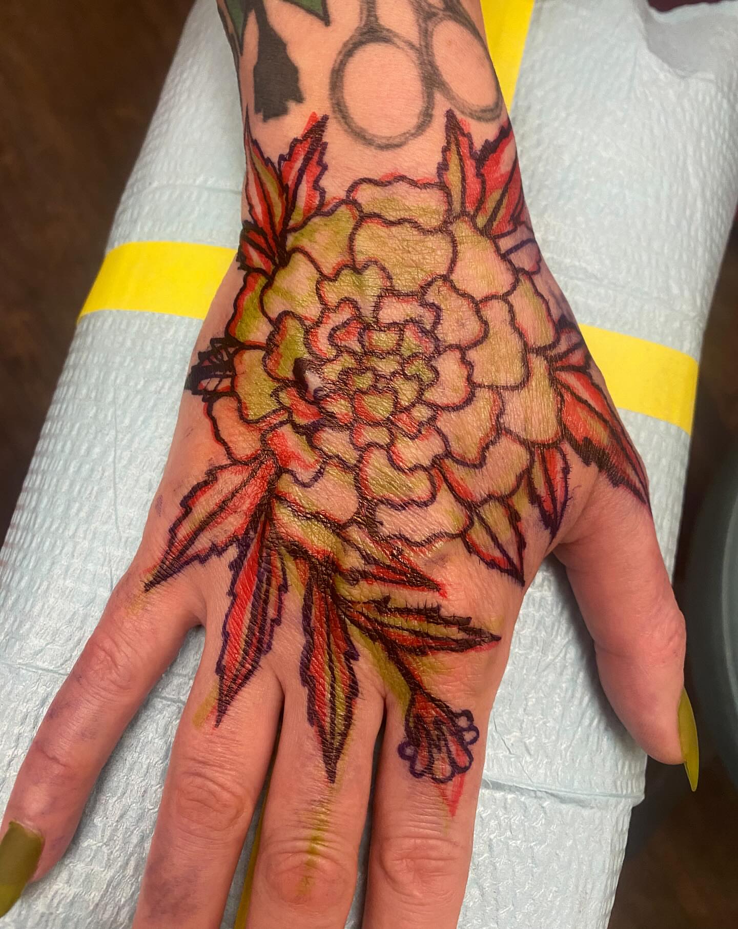 Peony American traditional tattoo on the hand by Abby Rose Estes