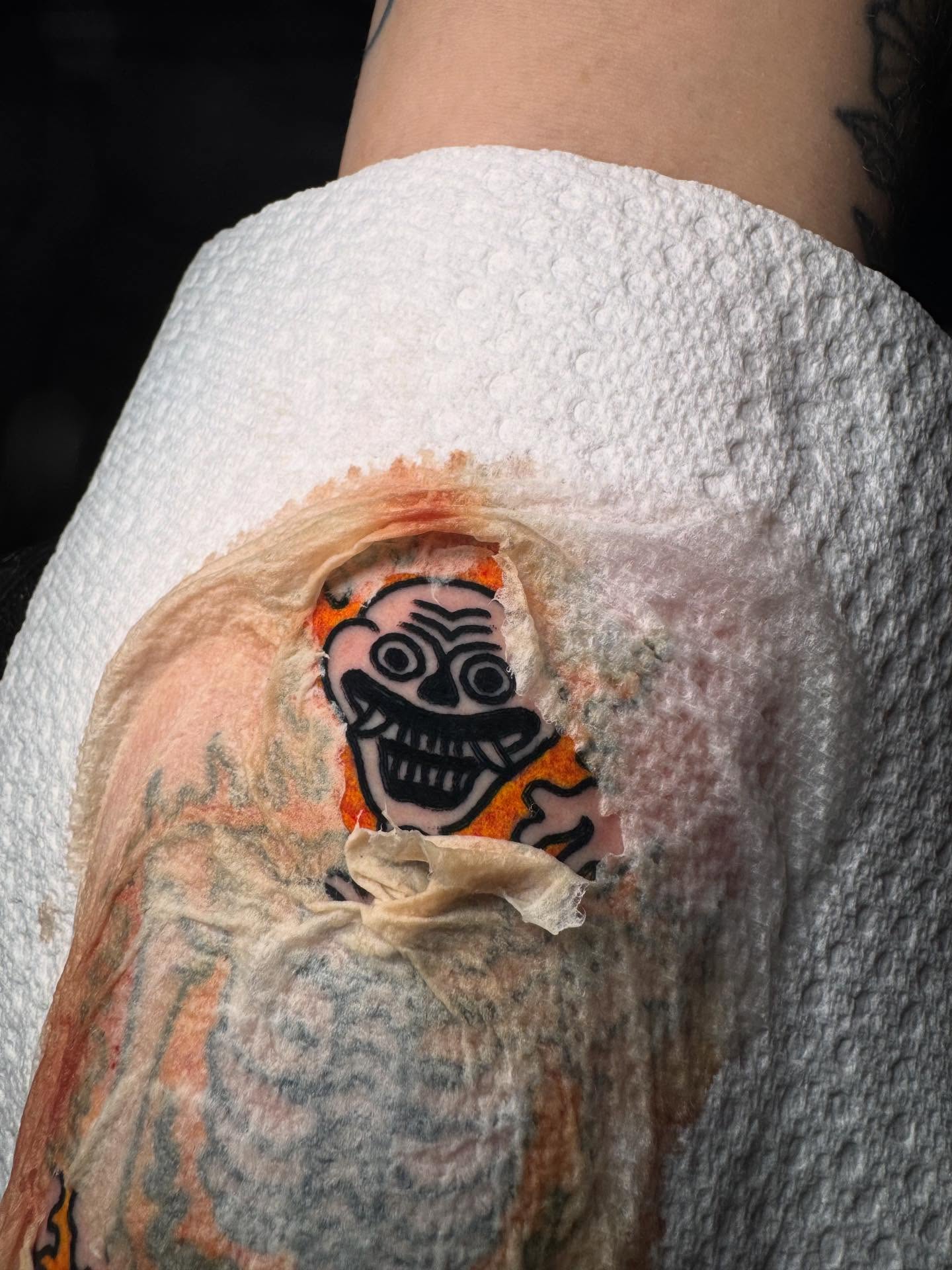 Clown face American traditional tattoo on the forearm by Jonathan Clapp, San Antonio, Texas