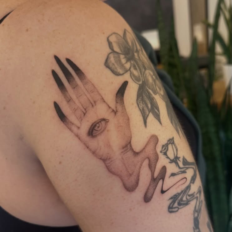 Hand and face realism tattoo on the shoulder by sara scak, Lakewood, Ohio