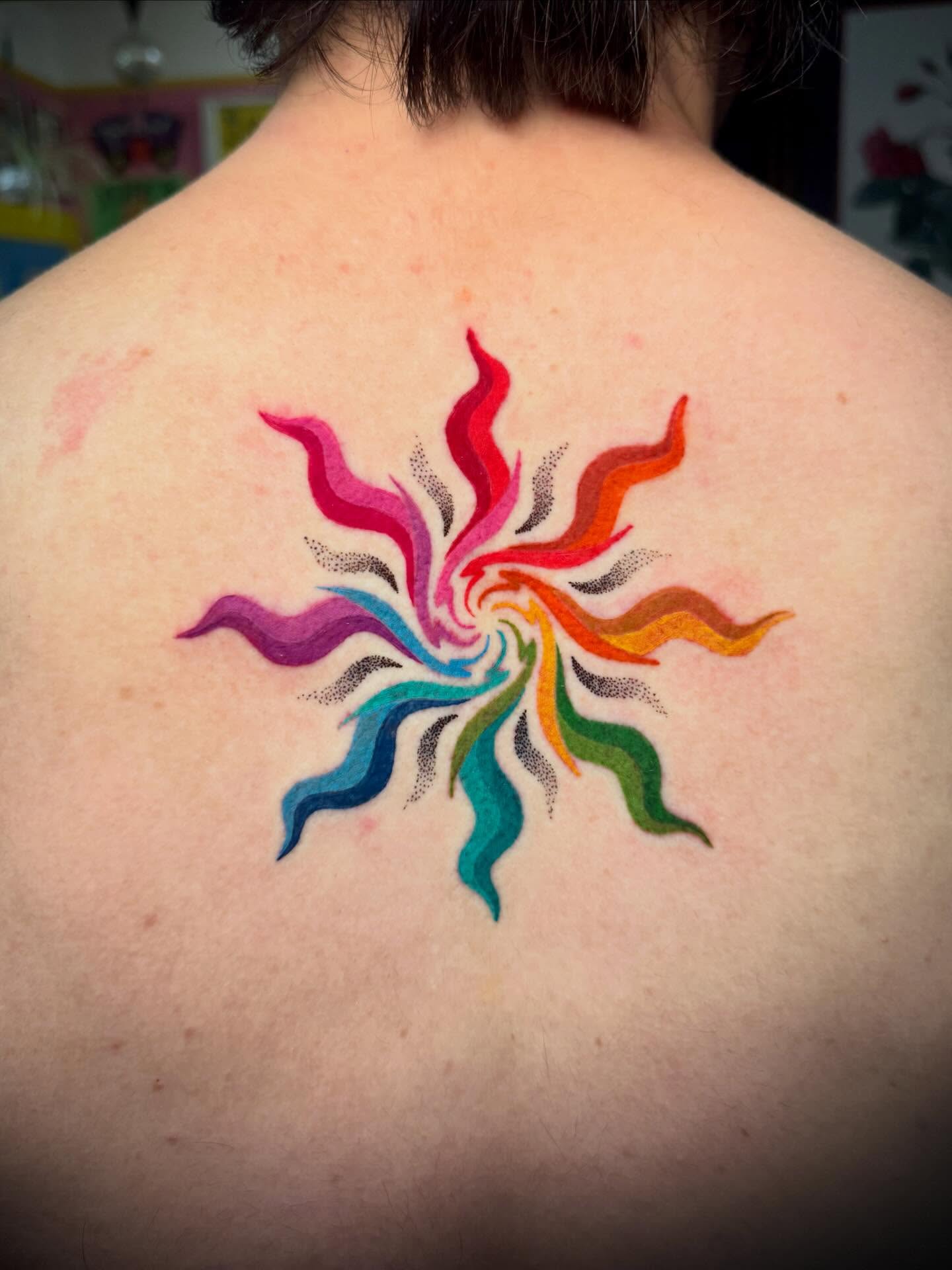 Rainbow burst dotwork tattoo on the back by π. ππππ, San Francisco, California