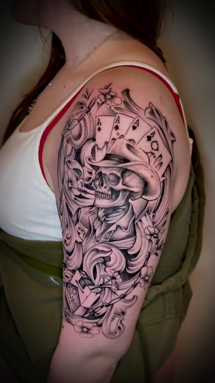 Skull with playing cards realism tattoo by Matthew Crawley