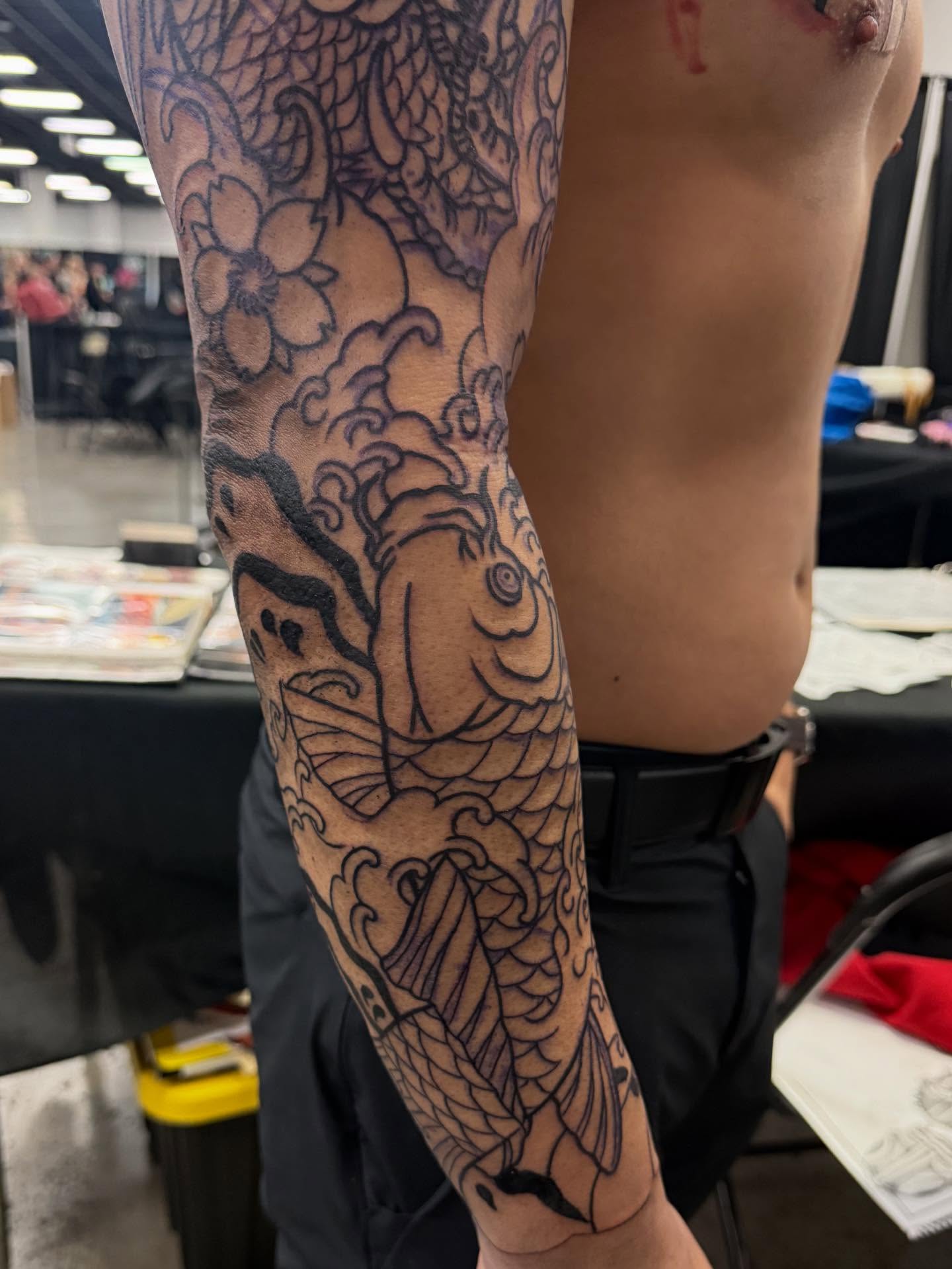 Koi fish and waves japanese irezumi tattoo on the forearm by Randall Croley El