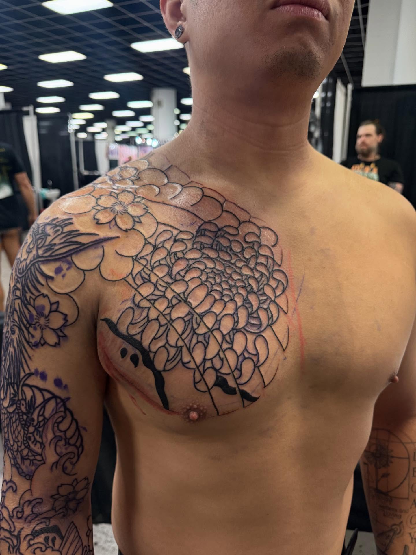 Chrysanthemum tree black and grey tattoo on the chest by Randall Croley El