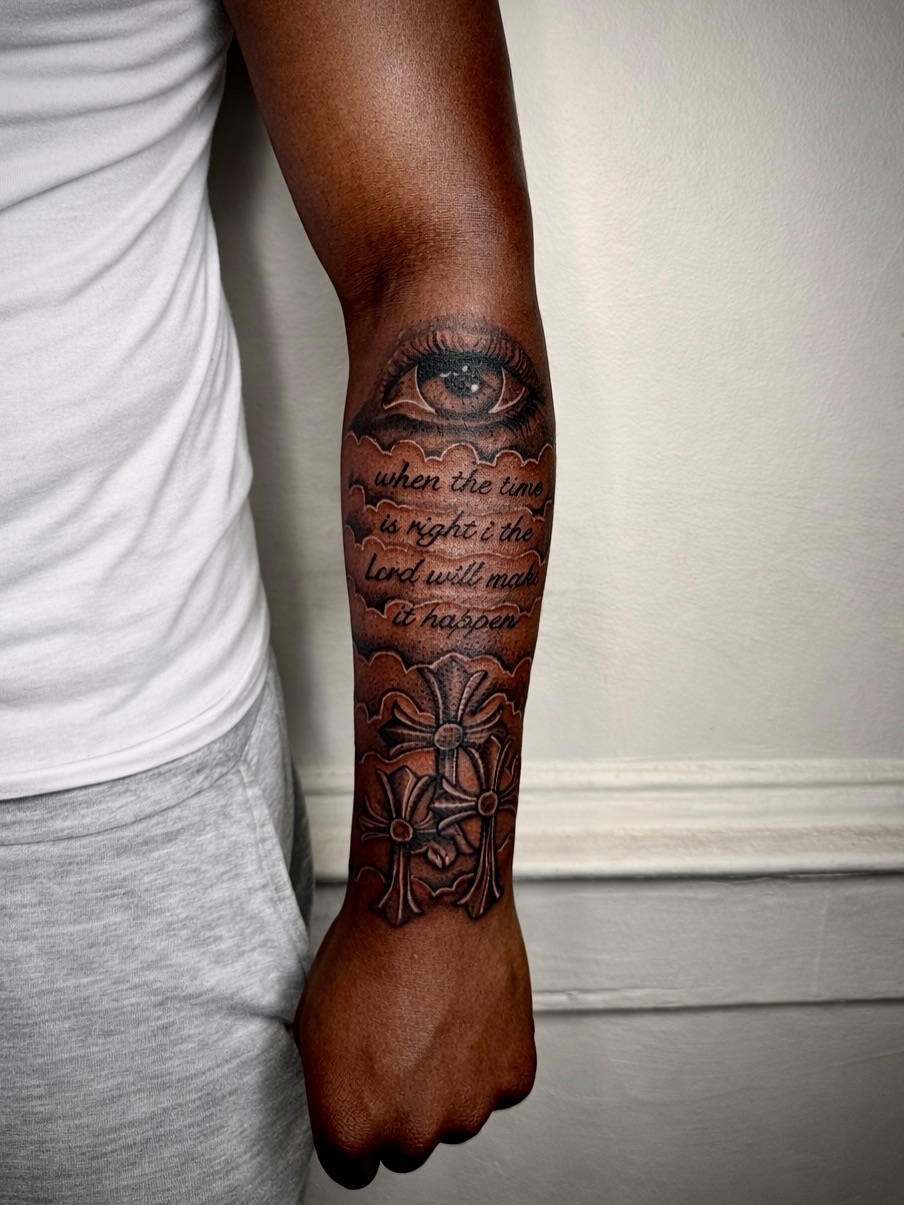 Eye, crosses, and scripture Chicano tattoo on the forearm by JayyeSosa