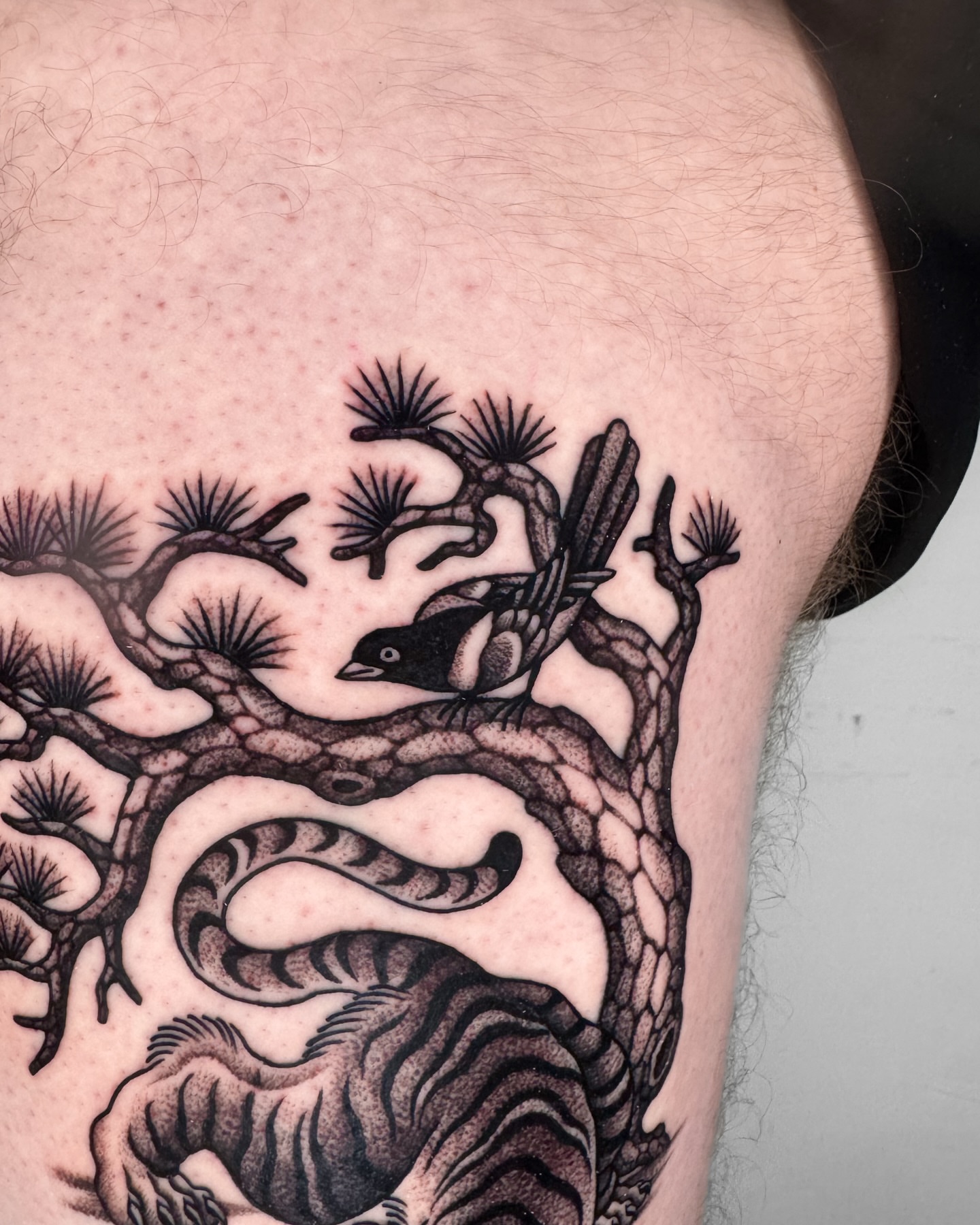 Tree and bird dotwork tattoo on the thigh by Jae Traditional Tattoo