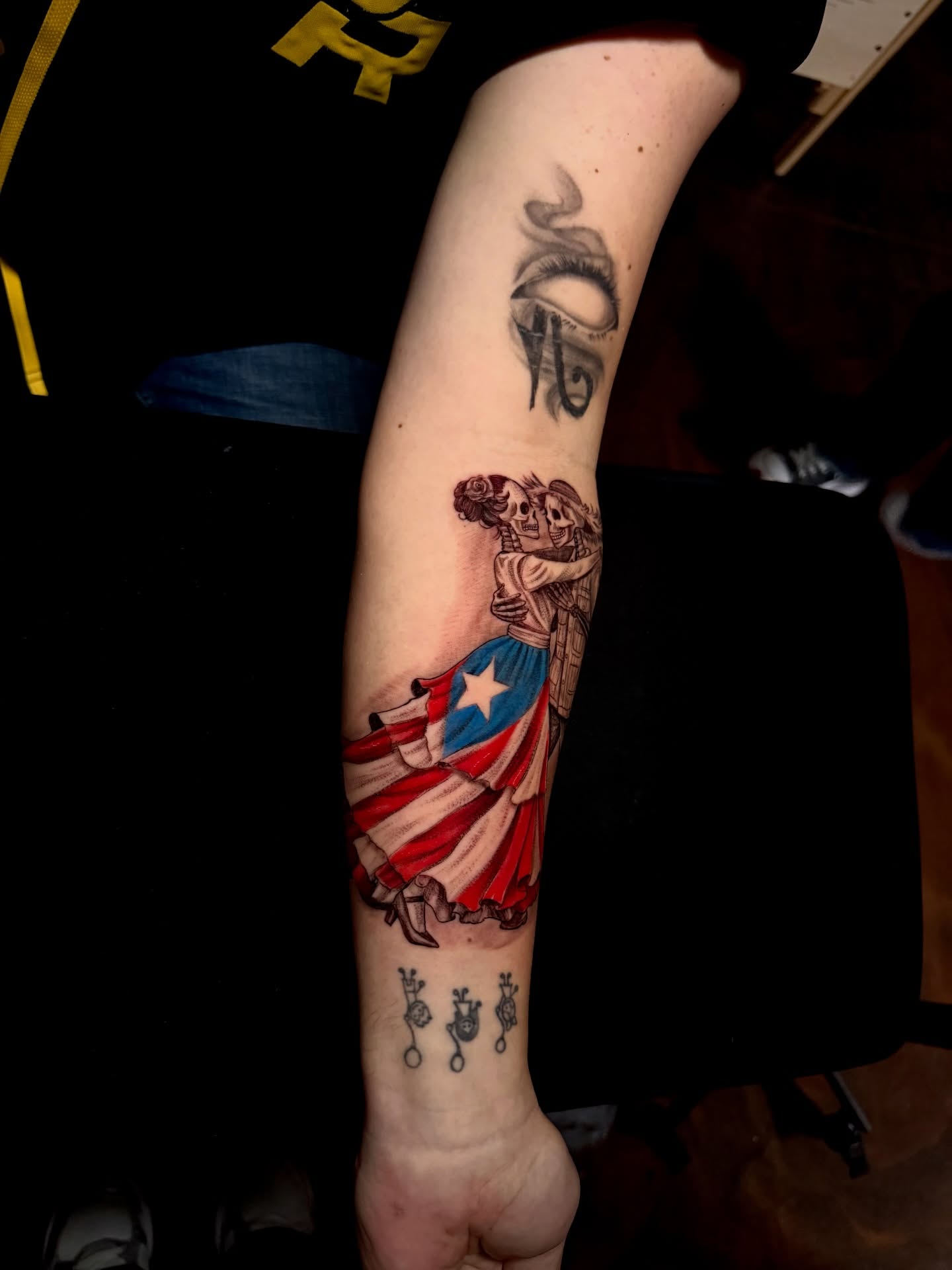 Danza de los muertos American traditional tattoo on the forearm by Tattoo Artist