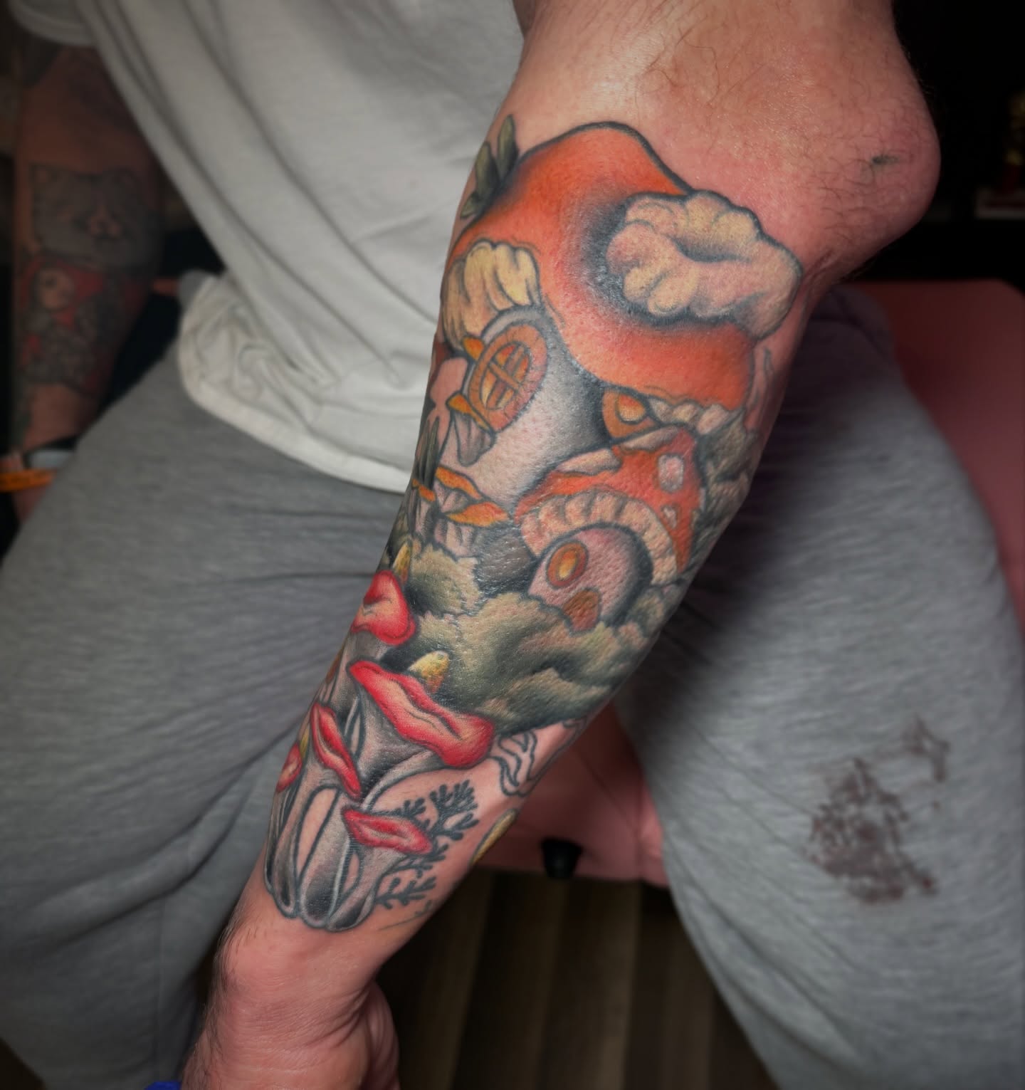 Smoking pipe and lips American traditional tattoo on the forearm by Lyndze Masters