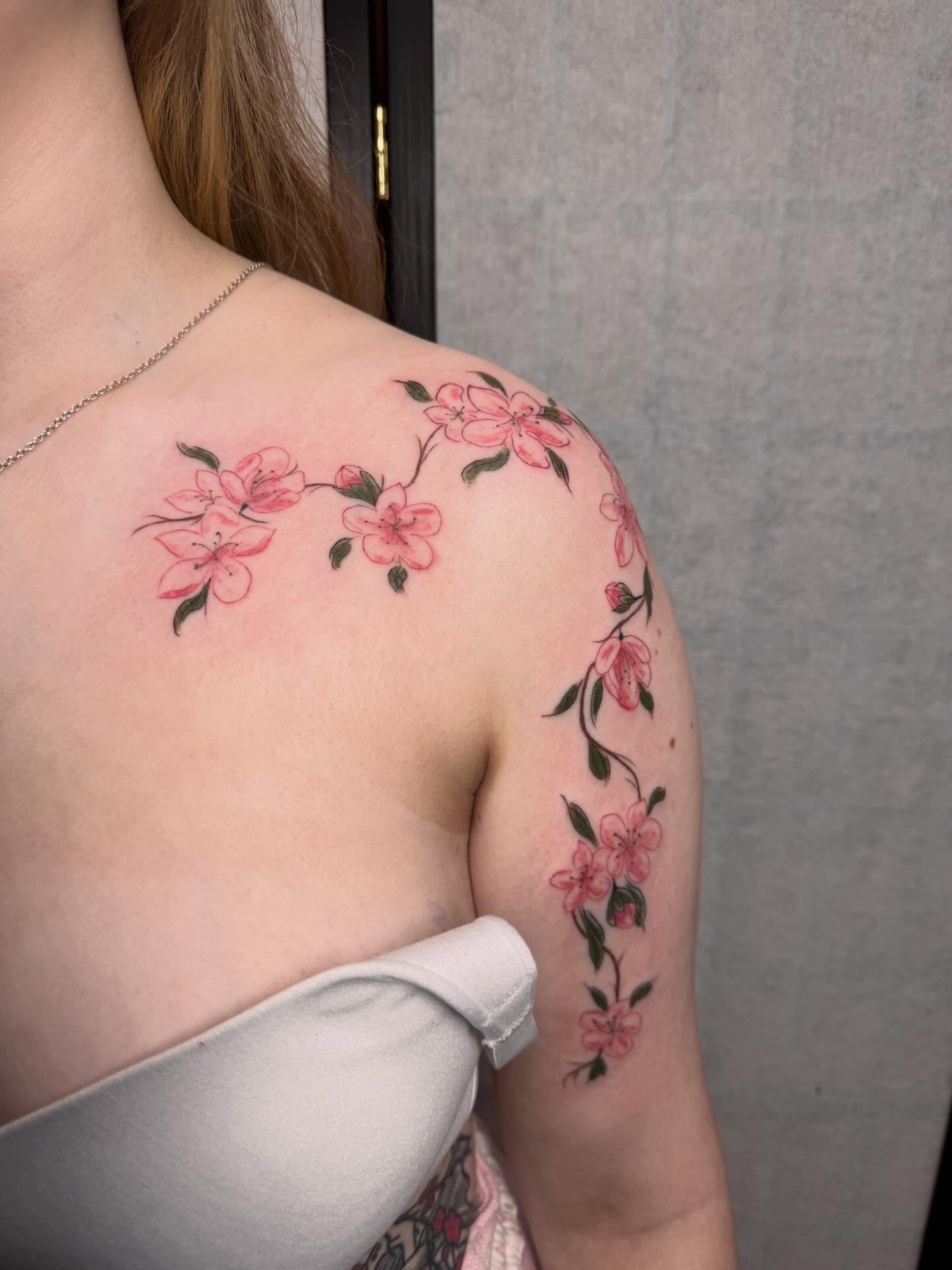 Cherry blossoms dotwork tattoo on the shoulder by olivia reed