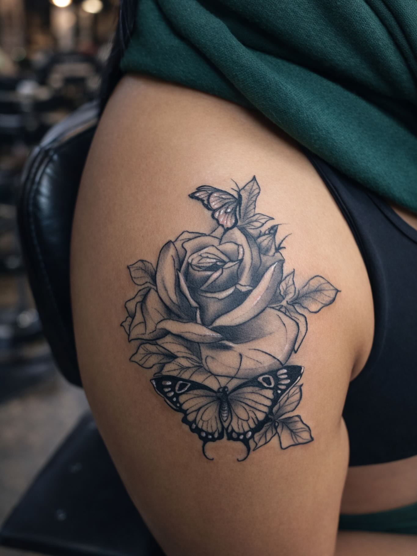 Rose and butterflies realism tattoo on the thigh by Angel Jmz