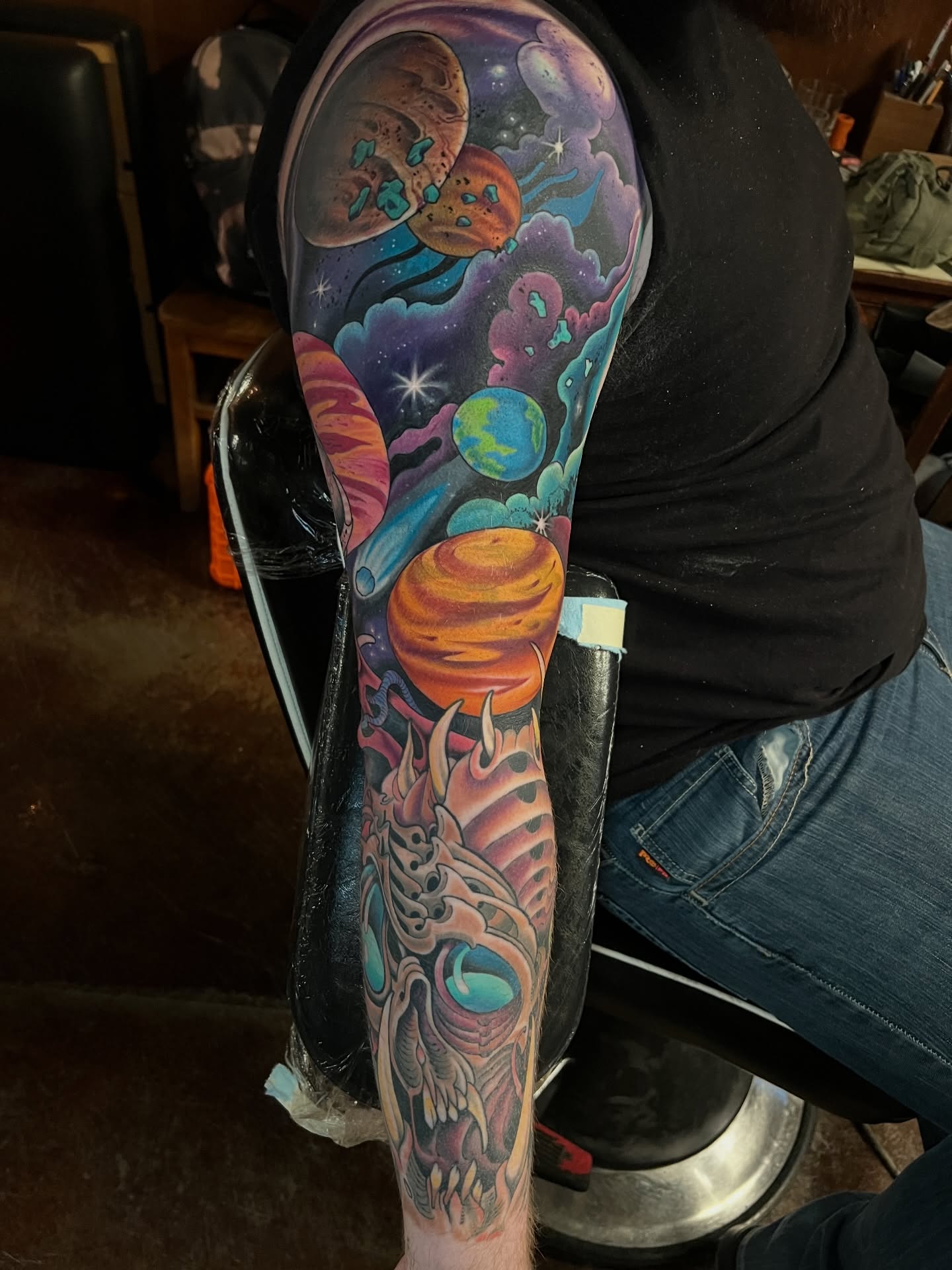 Space-themed tattoo dotwork tattoo on the upper arm by JoshUA Bowers, Des Moines, Iowa