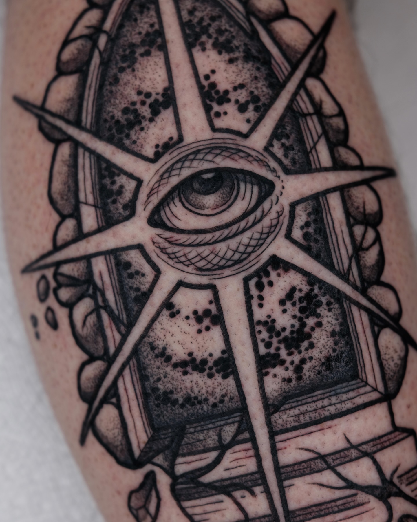 Eye and geometric patterns dotwork tattoo on the forearm by Kyle Patrick