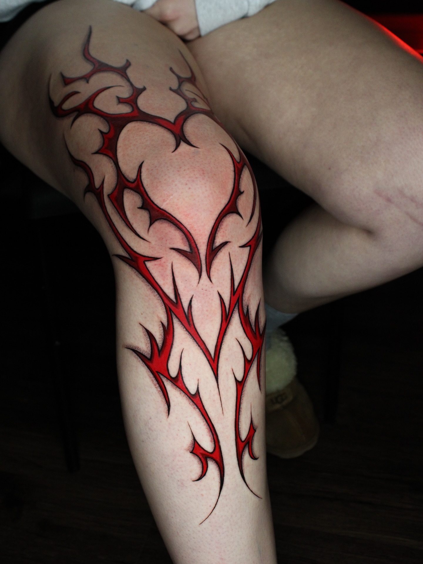 Thorn design tribal tattoo on the thigh by Eva Williams