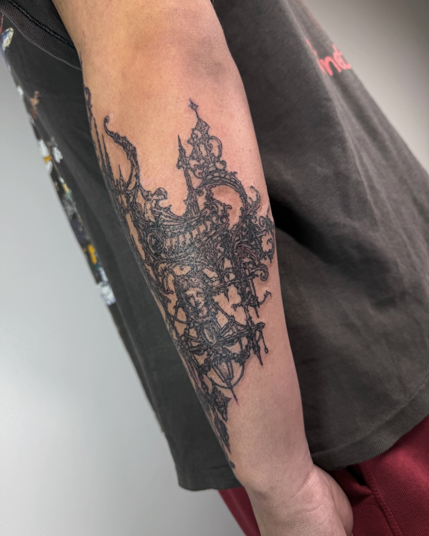 Abstract design black and grey tattoo on the forearm by Penelope
